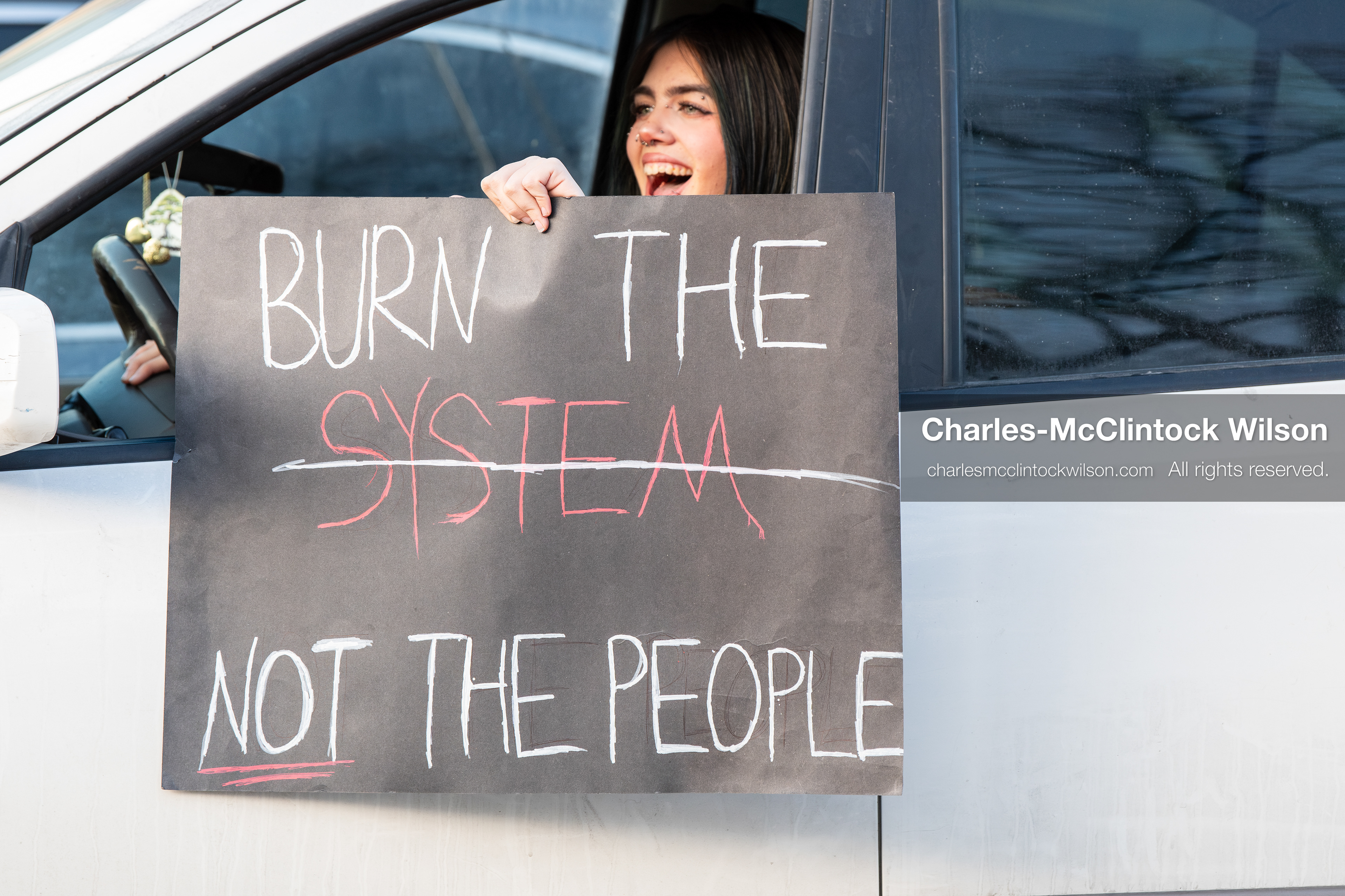 January 30, 2026, Salt Lake City, Utah, USA: A demonstrator displays a protest sign from a vehicle during an anti‑ICE protest in Salt Lake City, part of a nationwide response to immigration enforcement policies. (Credit Image: © Charles‑McClintock Wilson/ZUMA Press Wire)