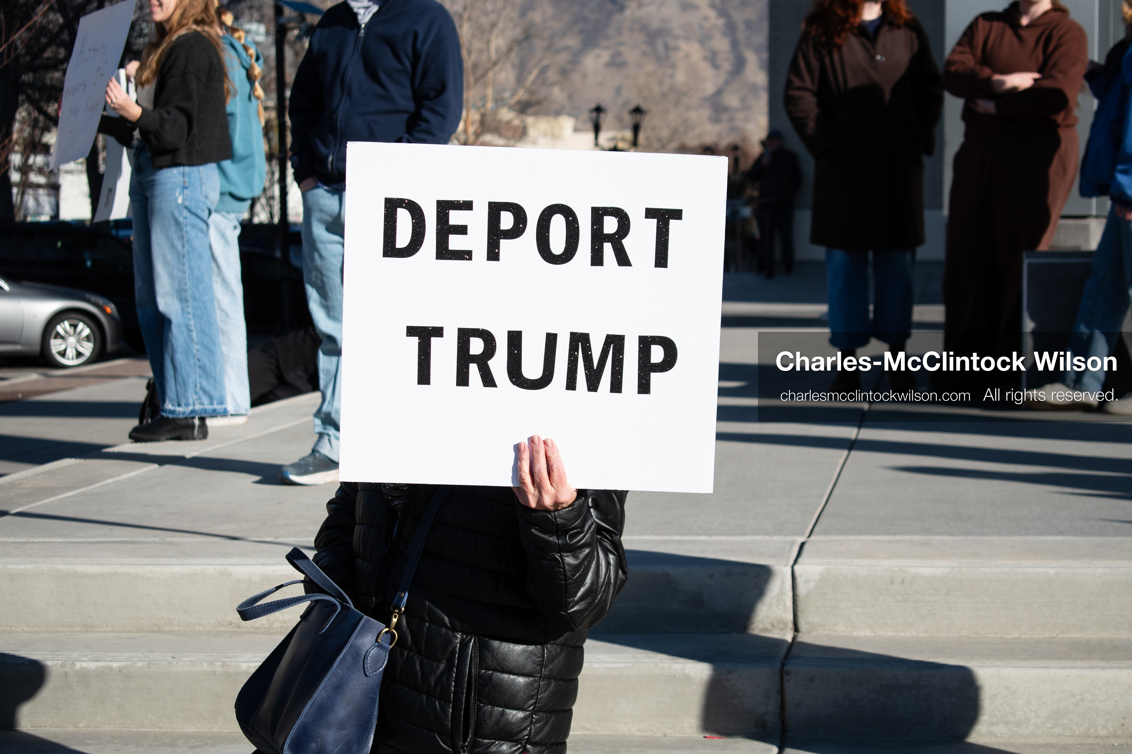  January 20, 2026, Provo, Utah, USA: A demonstrator stands outside Provo City Hall during the Free America Walkout protest in Provo Utah on January 20 2026. The nationwide event called for immigration reform and changes to detention practices. 
