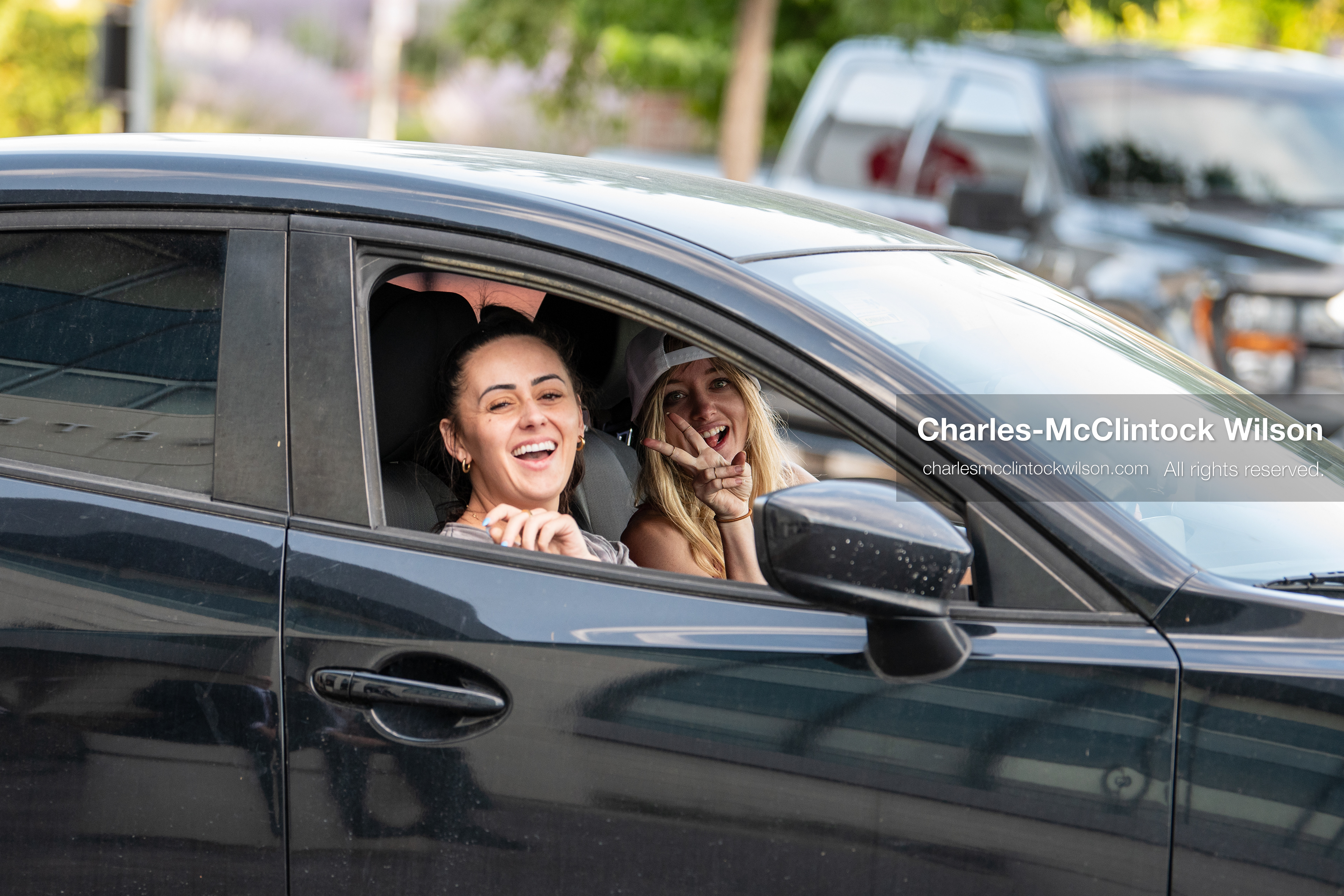 July 10, 2026, Provo, Utah, USA: BRANDI SICILIANI and BILLIE WEBB smile and gesture from a car outside the Fourth District Court in Provo, Utah, during the fifth day of the preliminary hearing in the Tyler Robinson case. (Credit Image: © Charles-McClintock Wilson/ZUMA Press Wire)