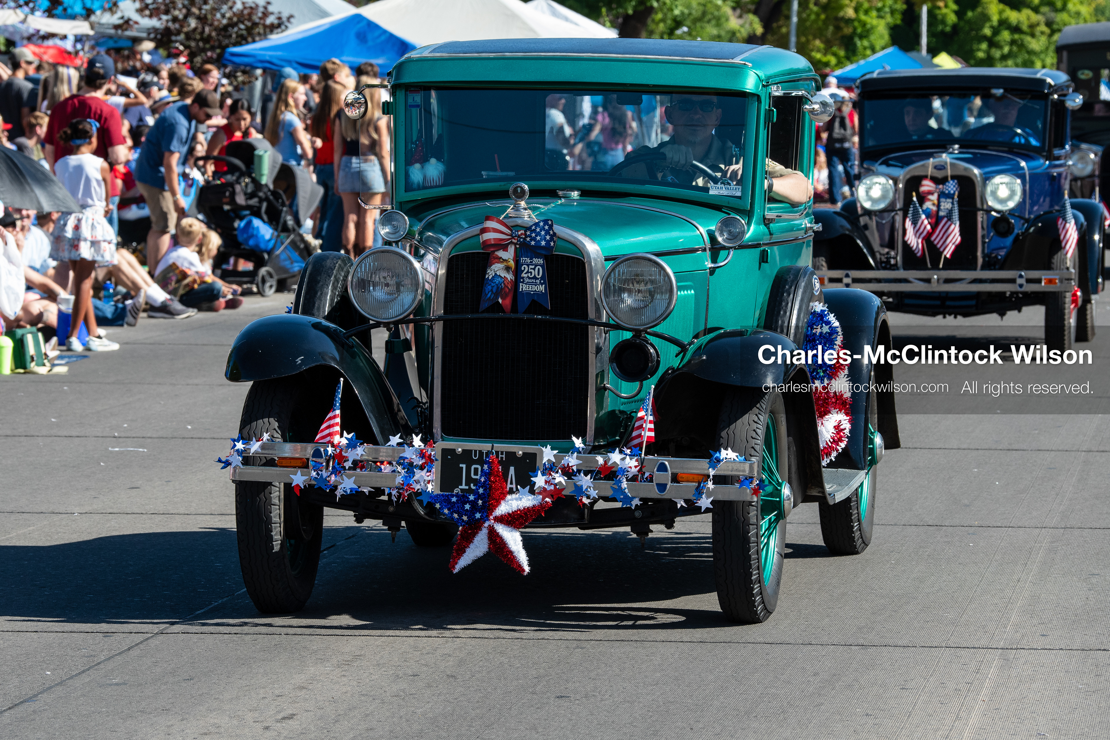 July 4, 2026, Provo, Utah, USA: Vintage classic cars drive along University Avenue past crowds lining the street during America's Freedom Festival Grand Parade in Provo, Utah, Saturday, July 4, 2026. The annual Independence Day event features expanded programming to honor the 250th anniversary of United States independence. (Credit Image: © Charles-McClintock Wilson/ZUMA Press Wire)