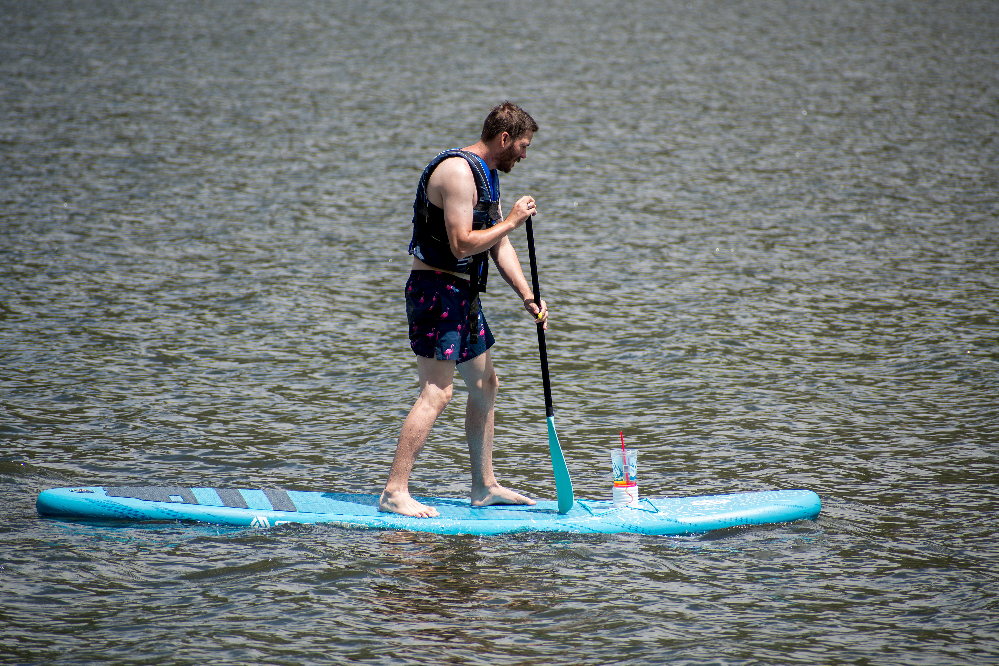 Summit County, Utah – July 20, 2025: A man paddleboards across the water at Smith and Morehouse Reservoir. 