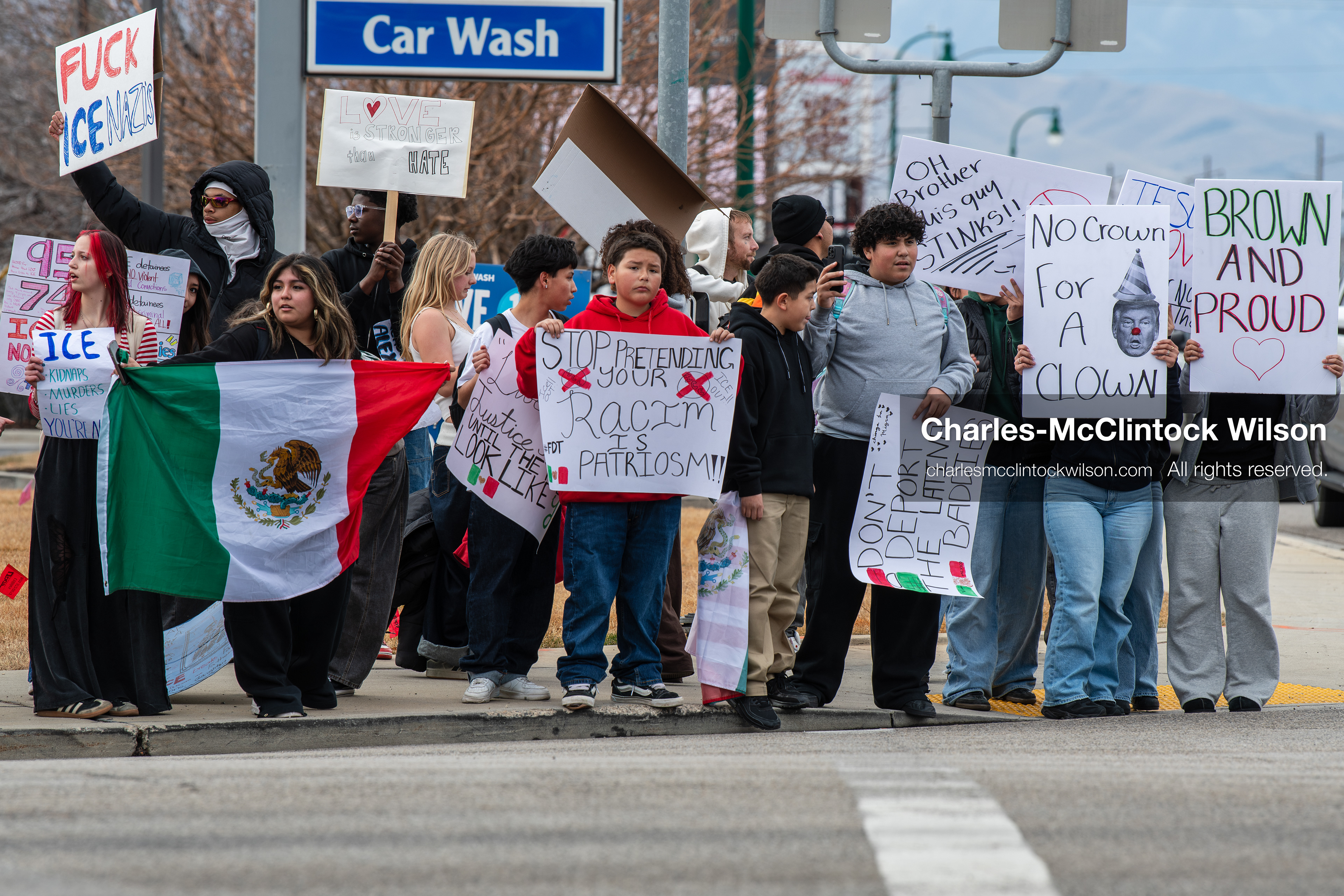 February 11, 2026, Orem, Utah, USA: Students stand on the sidewalk along State Street during a student‑led protest involving participants from multiple Orem schools. (Credit Image: © Charles‑McClintock Wilson/ZUMA Press Wire)