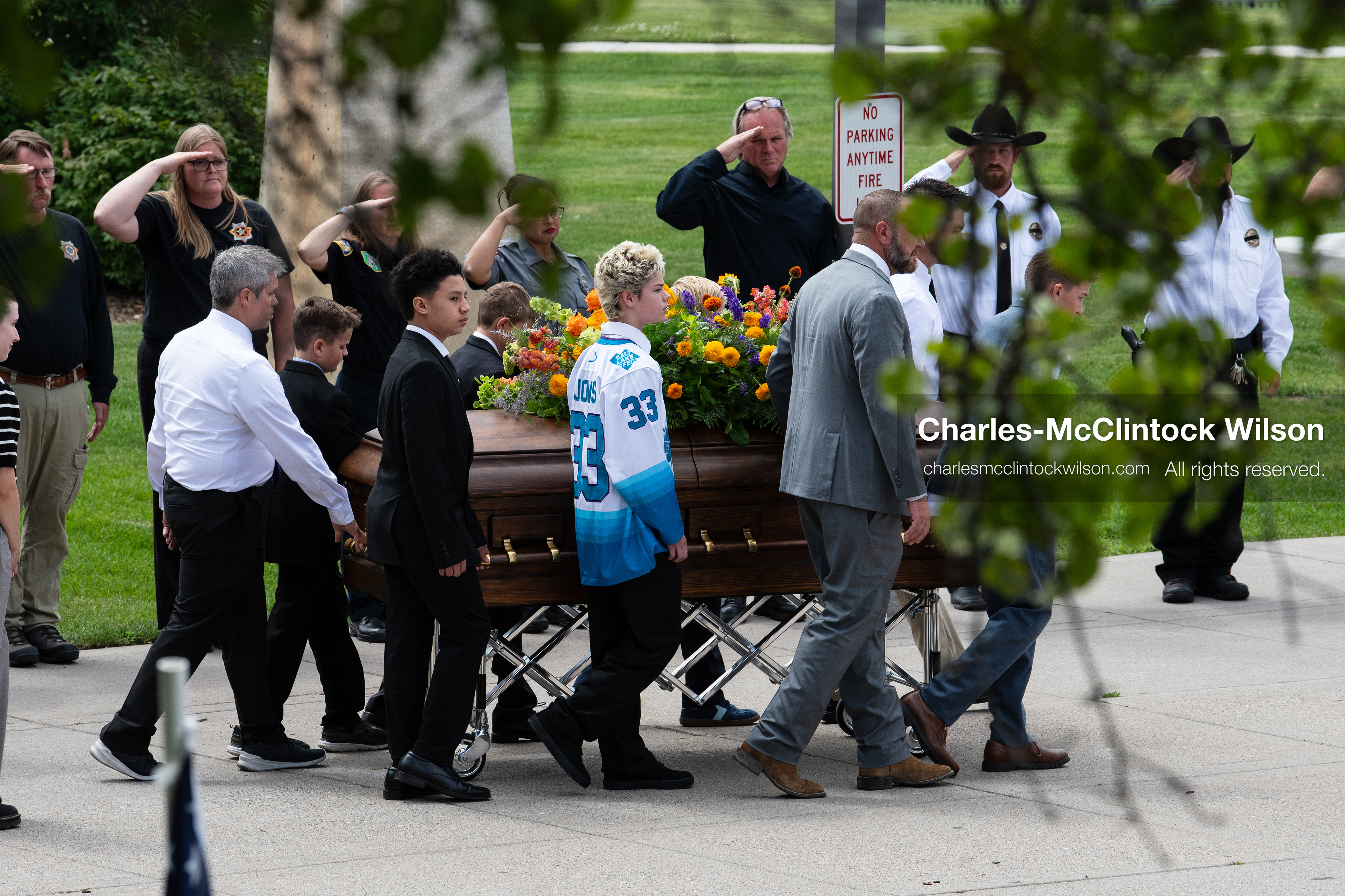 Pallbearers and family members escort the casket of a Long family member outside the UCCU Center at Utah Valley University in Orem, Utah, on Wednesday, July 29, 2026. More than 300 people came to the public memorial ceremony to honor Provo Fire Captain Spencer Long, his wife Katrina, and three of their sons, who died after a flash flood hit their campsite near the Sunglow Campground in Wayne County. (Photo by Charles-McClintock Wilson/Sipa USA)