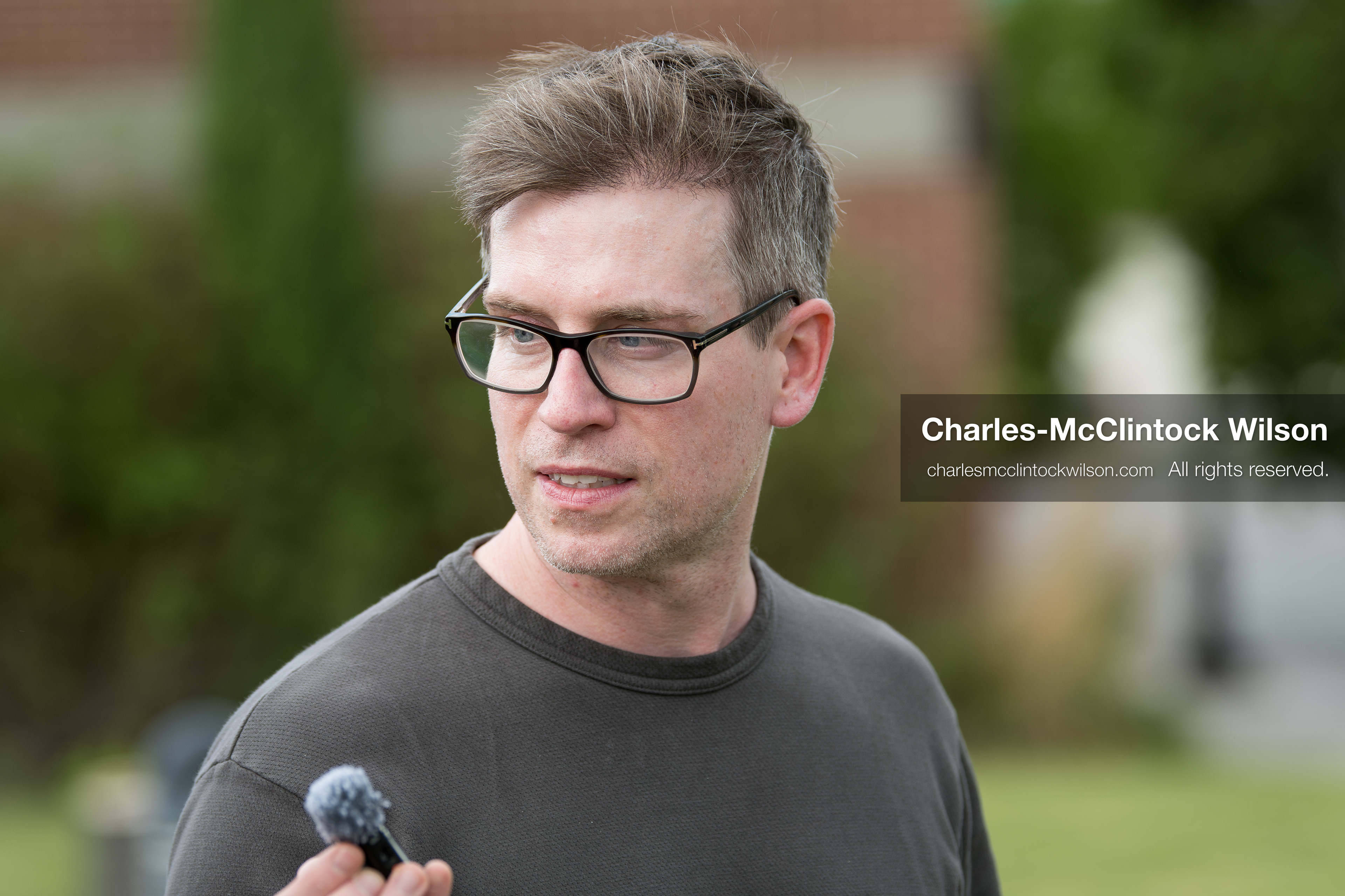 May 13, 2026, Brigham City, Utah, USA: US political satirist and digital creator WALTER MASTERSON holds a microphone while speaking outside the Box Elder County Justice Center in Brigham City, Utah, during a gathering over the proposed data‑center project backed by businessman Kevin O’Leary, which has drawn public concern over water use, power demand, and transparency. (Credit Image: © Charles‑McClintock Wilson/ZUMA Press Wire)