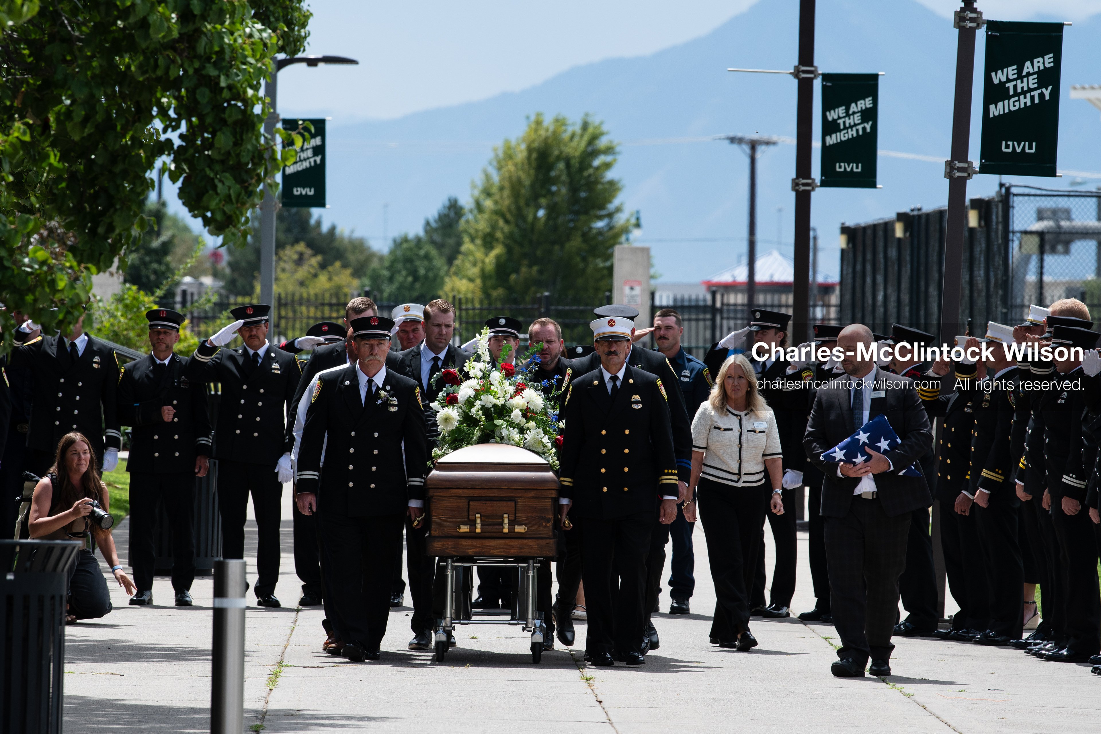 Firefighters and pallbearers escort the casket of Provo Fire Captain Spencer Long outside the UCCU Center on the campus of Utah Valley University in Orem, Utah, on Wednesday, July 29, 2026. More than 300 people came to the public memorial ceremony to honor Captain Long, his wife Katrina, and three of their sons, who died after a flash flood hit their campsite near the Sunglow Campground in Wayne County. (Photo by Charles-McClintock Wilson/Sipa USA)