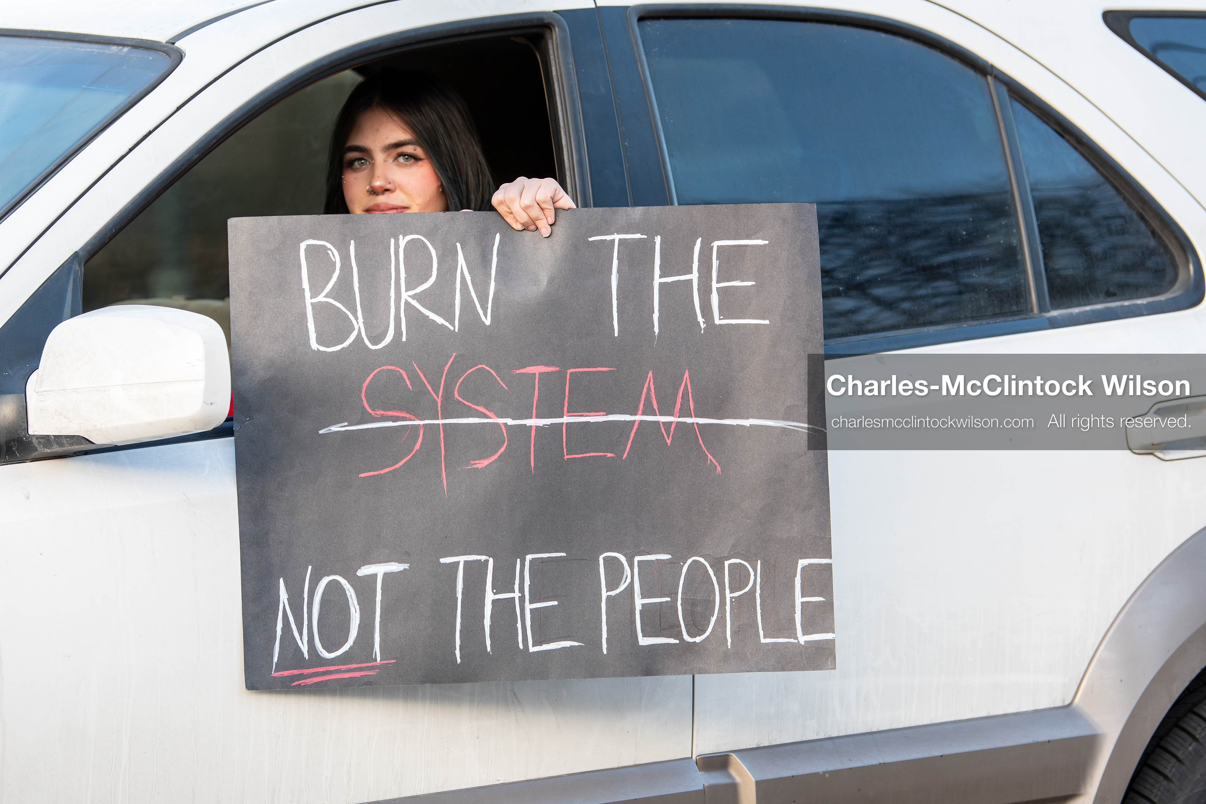January 30, 2026, Salt Lake City, Utah, USA: A demonstrator displays a protest sign from a vehicle during an anti‑ICE protest in Salt Lake City, part of a nationwide response to immigration enforcement policies. (Credit Image: © Charles‑McClintock Wilson/ZUMA Press Wire)