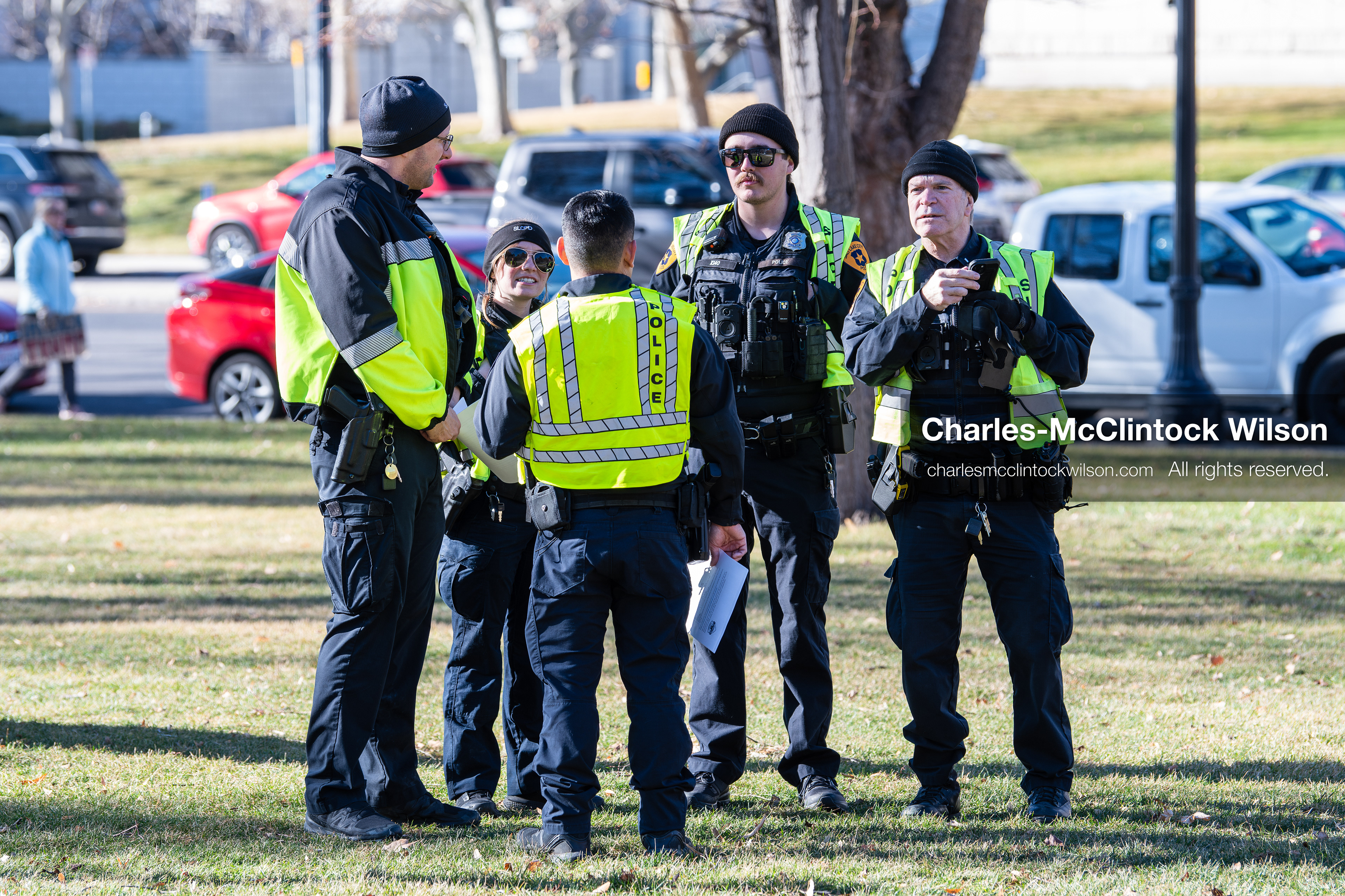 Salt Lake City, Utah, January 10, 2026: Salt Lake City Police Department officers gather on the lawn near Washington Square Park during the ICE Out for Good protest, a demonstration calling for justice for Renee Nicole Good. Officers wore cold‑weather gear and high‑visibility vests. (Credit Image: © Charles‑McClintock Wilson/ZUMA Press Wire)