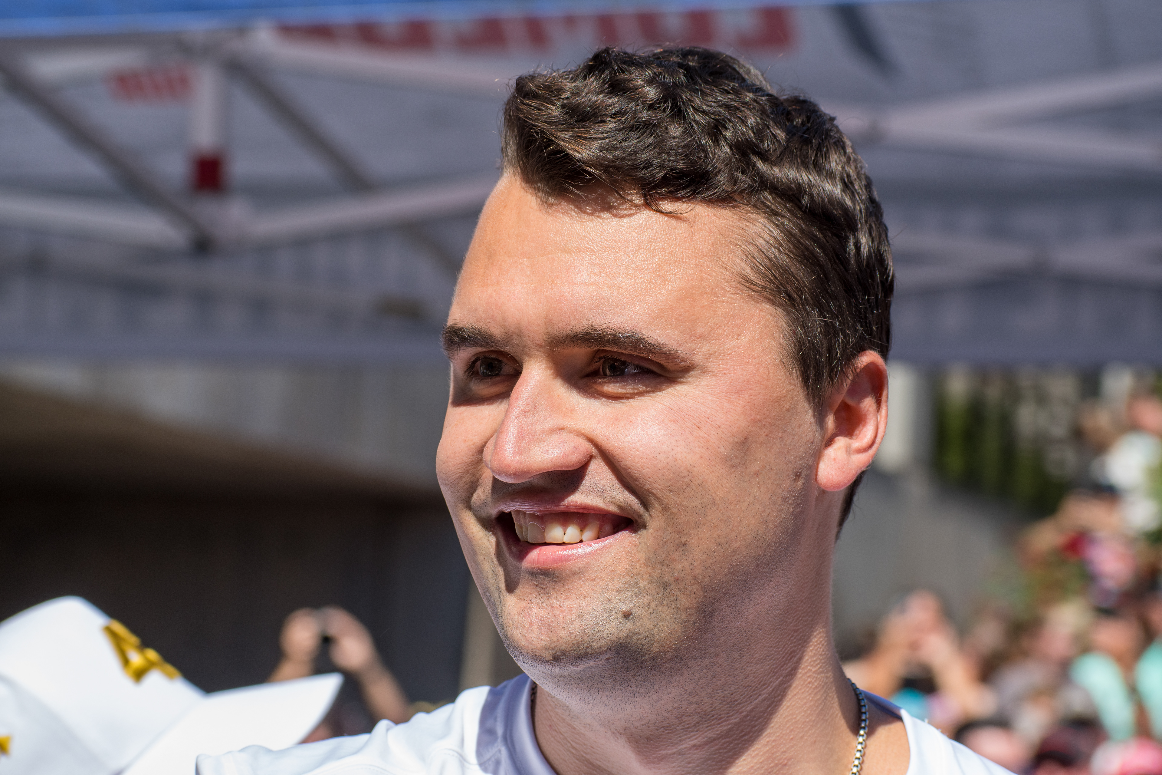 OREM, UTAH – SEPTEMBER 10, 2025: Charlie Kirk speaks with attendees during a public event at Utah Valley University. Positioned near a promotional booth and surrounded by supporters, Kirk appears engaged and expressive in one of his final public moments. The image reflects the atmosphere of direct outreach and energized dialogue that defined the gathering. © Charles-McClintock Wilson / ZUMA Press