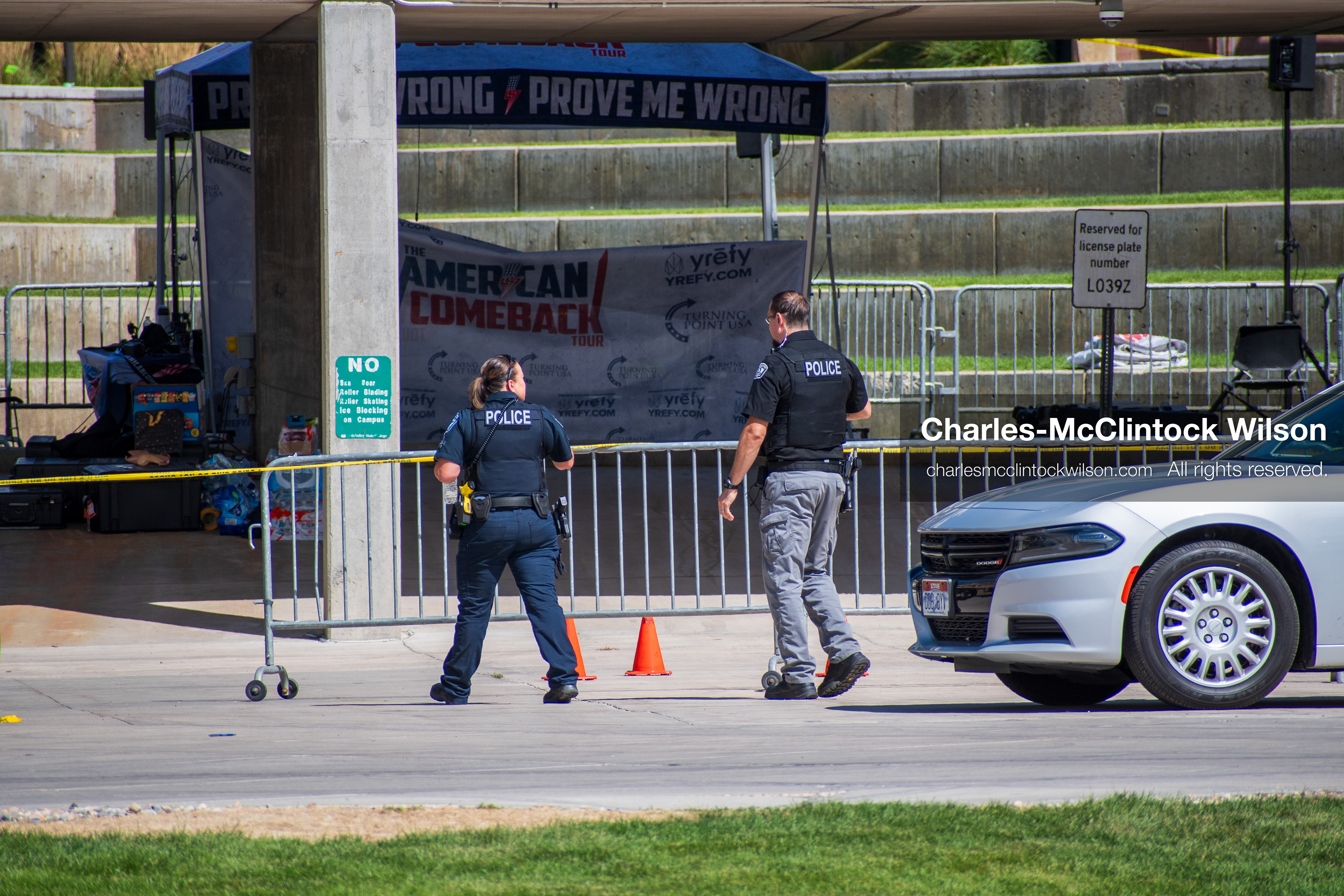 September 12, 2025, Orem, Utah, USA: Investigators and police officers secure the canopy-covered courtyard at Utah Valley University in Orem, Utah, where conservative activist CHARLIE KIRK was fatally shot during a public speaking event on September 10, 2025. KIRK, CEO of Turning Point USA, was seated beneath the canopy when a single bullet struck him in the neck.   (Credit Image: © Charles‑McClintock Wilson/ZUMA Press Wire)