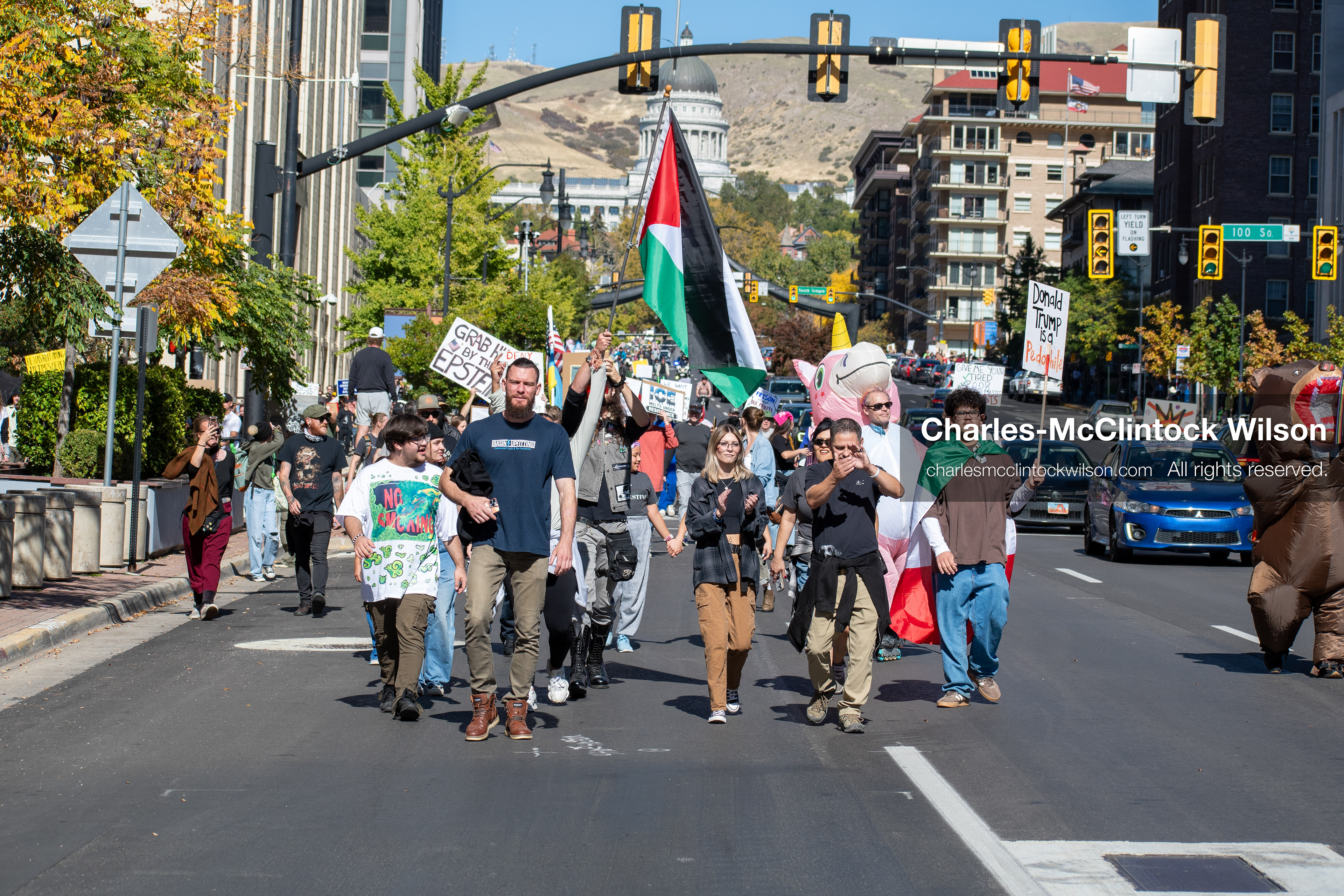 October 18, 2025, Salt Lake City, Utah, USA: Demonstrators march along South State Street during a "No Kings" protest in Salt Lake City, Utah. The protest was part of a nationwide mobilization.
