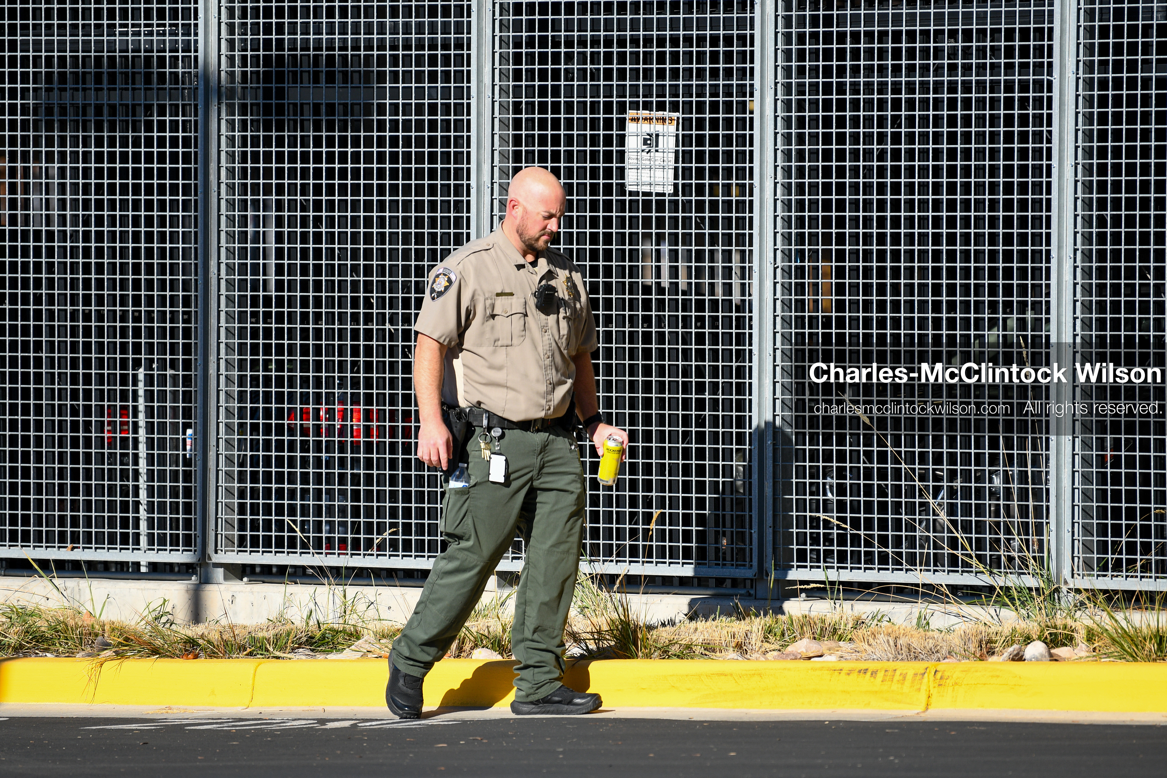PROVO, UTAH, USA – DECEMBER 11, 2025: A Utah County Sheriff’s Office officer patrols the parking lot of the Fourth District Court in Provo during the first in‑person court appearance of Tyler Robinson in the Charlie Kirk murder case. (Credit Image: © Charles‑McClintock Wilson/ZUMA Press Wire)