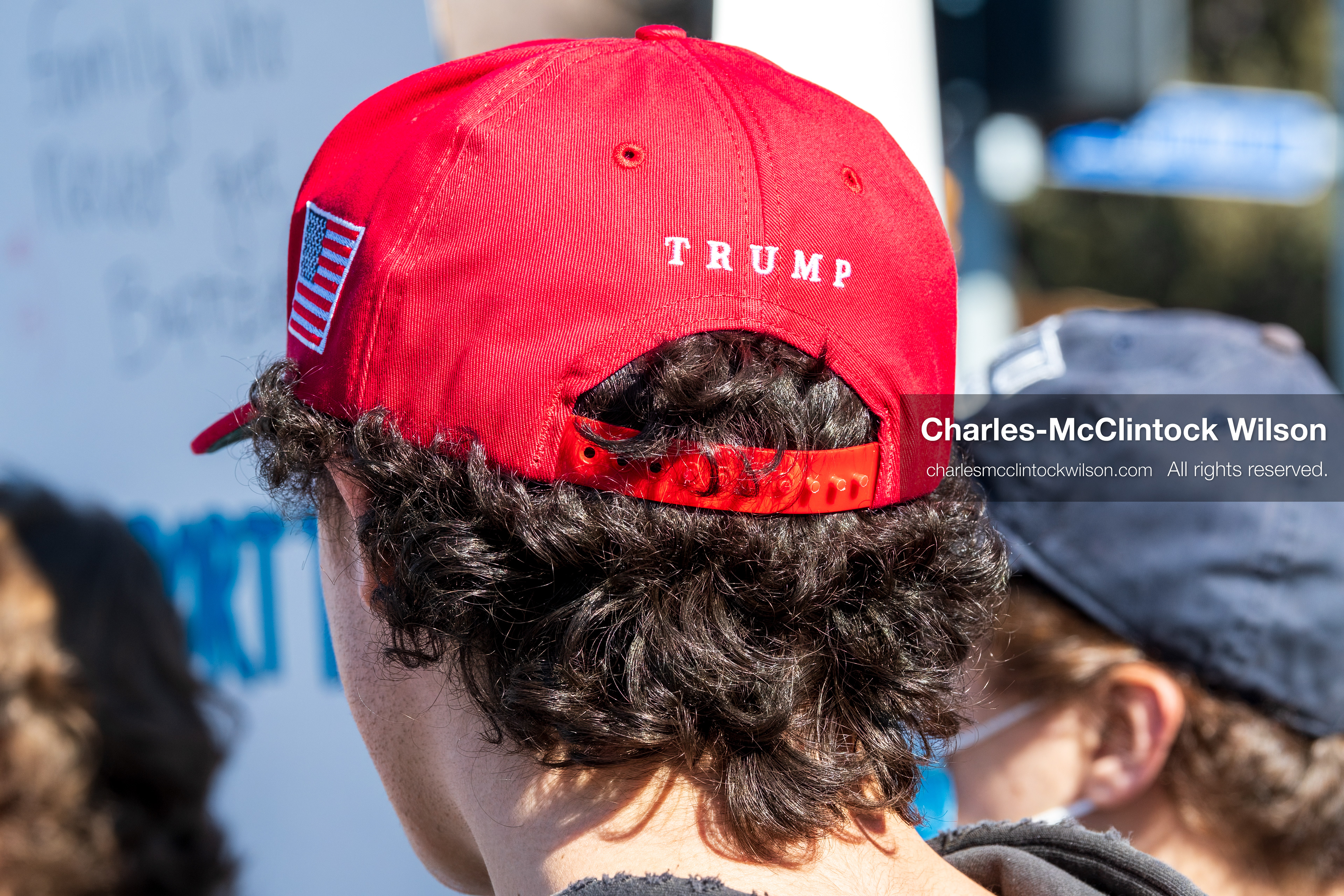 February 5, 2026, Provo, Utah, USA: A person wearing a red Make America Great Again hat stands among demonstrators near Brigham Young University in Provo during a gathering opposing the presence of US Customs and Border Protection recruiters at a career fair held on the BYU campus. (Credit Image: © Charles McClintock Wilson/ZUMA Press Wire)