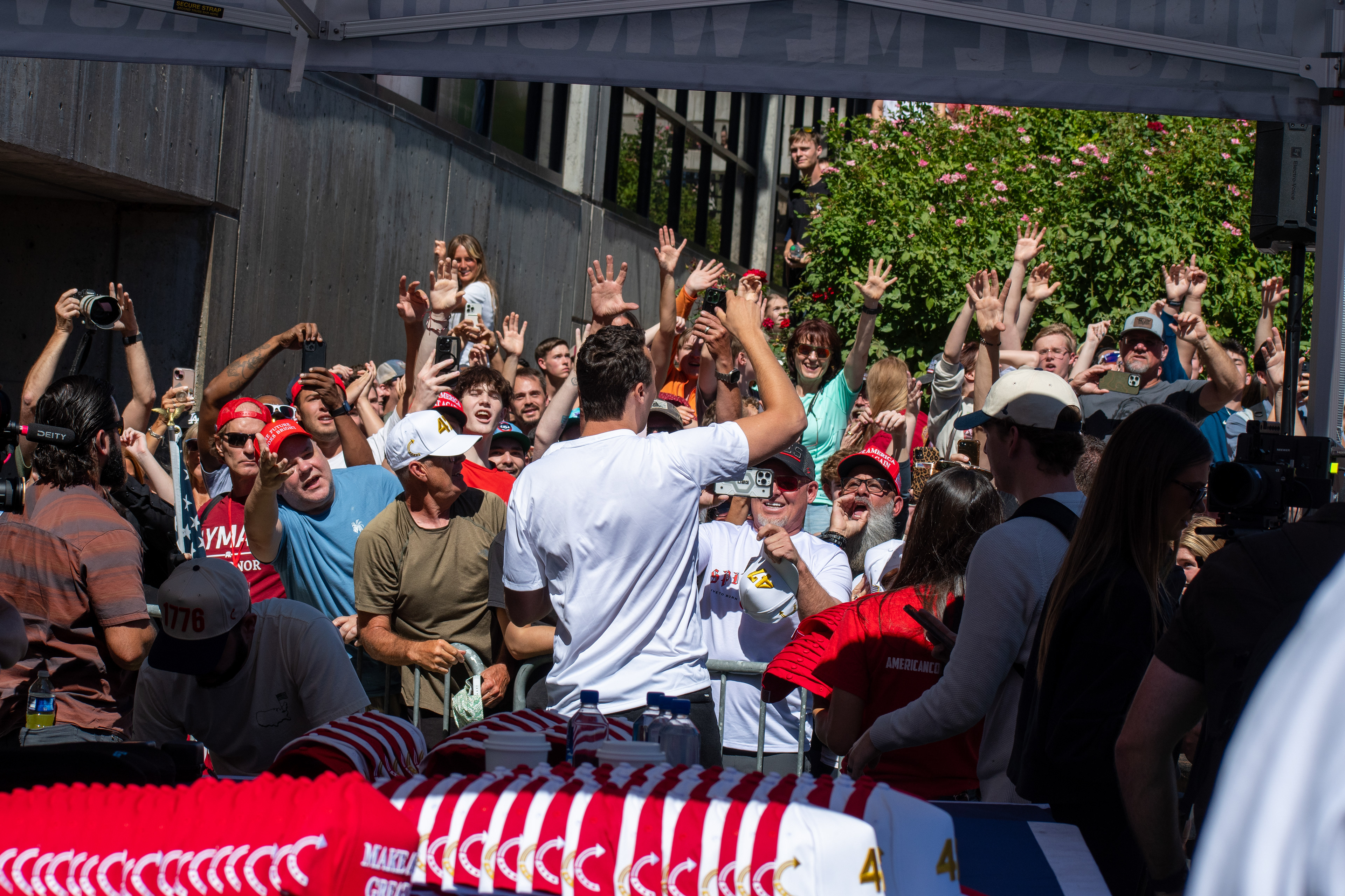 OREM, UTAH – SEPTEMBER 10, 2025: Conservative activist Charlie Kirk greets supporters at Utah Valley University during a public appearance that drew thousands. Known for his outspoken political commentary and youth mobilization efforts, Kirk engaged directly with attendees in the UVU Courtyard, where supporters responded with raised hands, cheers, and visible enthusiasm. The image captures a moment of energized political engagement shortly before the shooting incident that disrupted the event. (Photo by Charles-McClintock Wilson/ZUMA Press Wire)