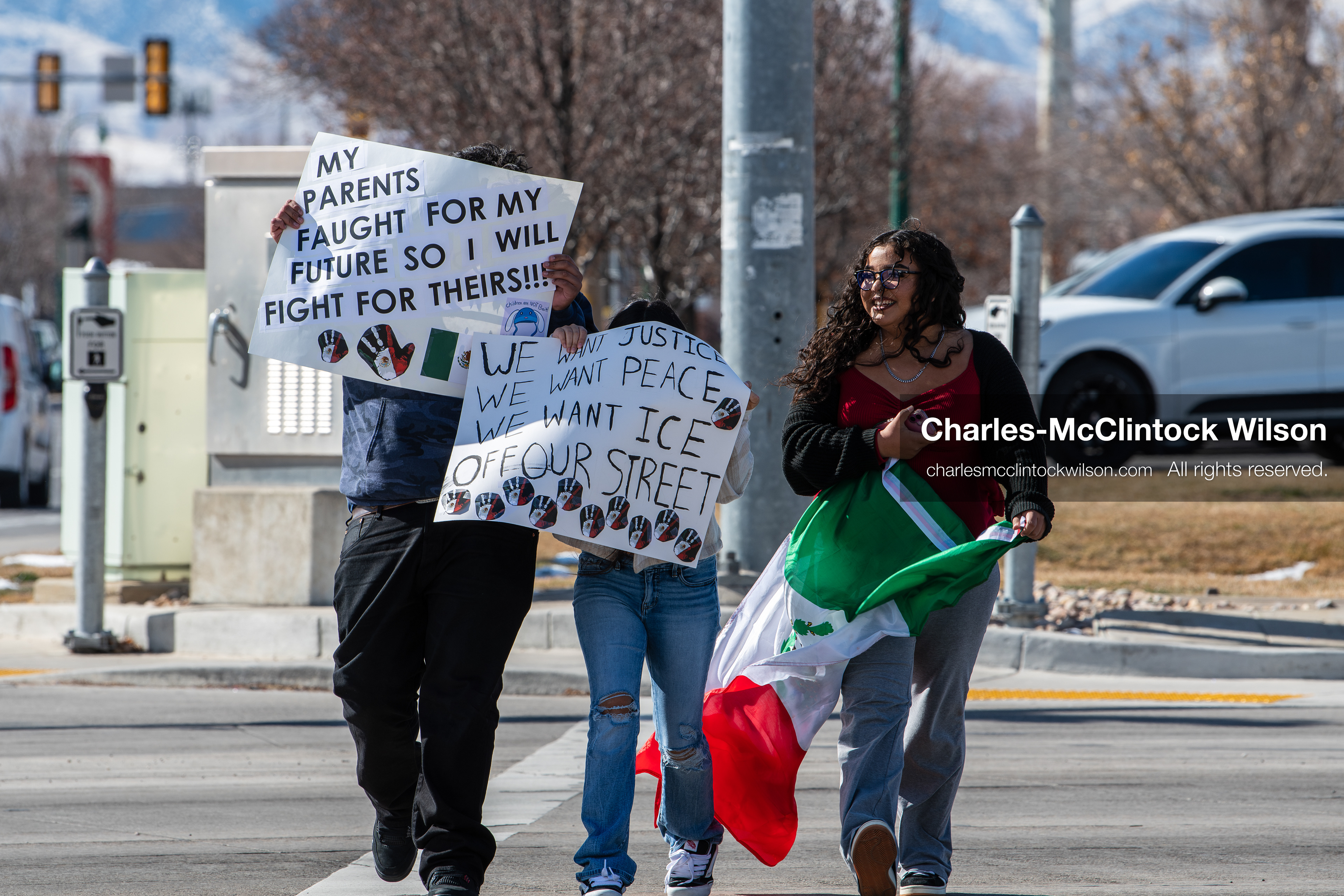 February 20, 2026, Orem, Utah, USA: Participants cross State Street in front of Orem City Hall during a student led protest against ICE. Demonstrators move through the crosswalk as vehicles wait in the area. (Credit Image: © Charles McClintock Wilson/ZUMA Press Wire)