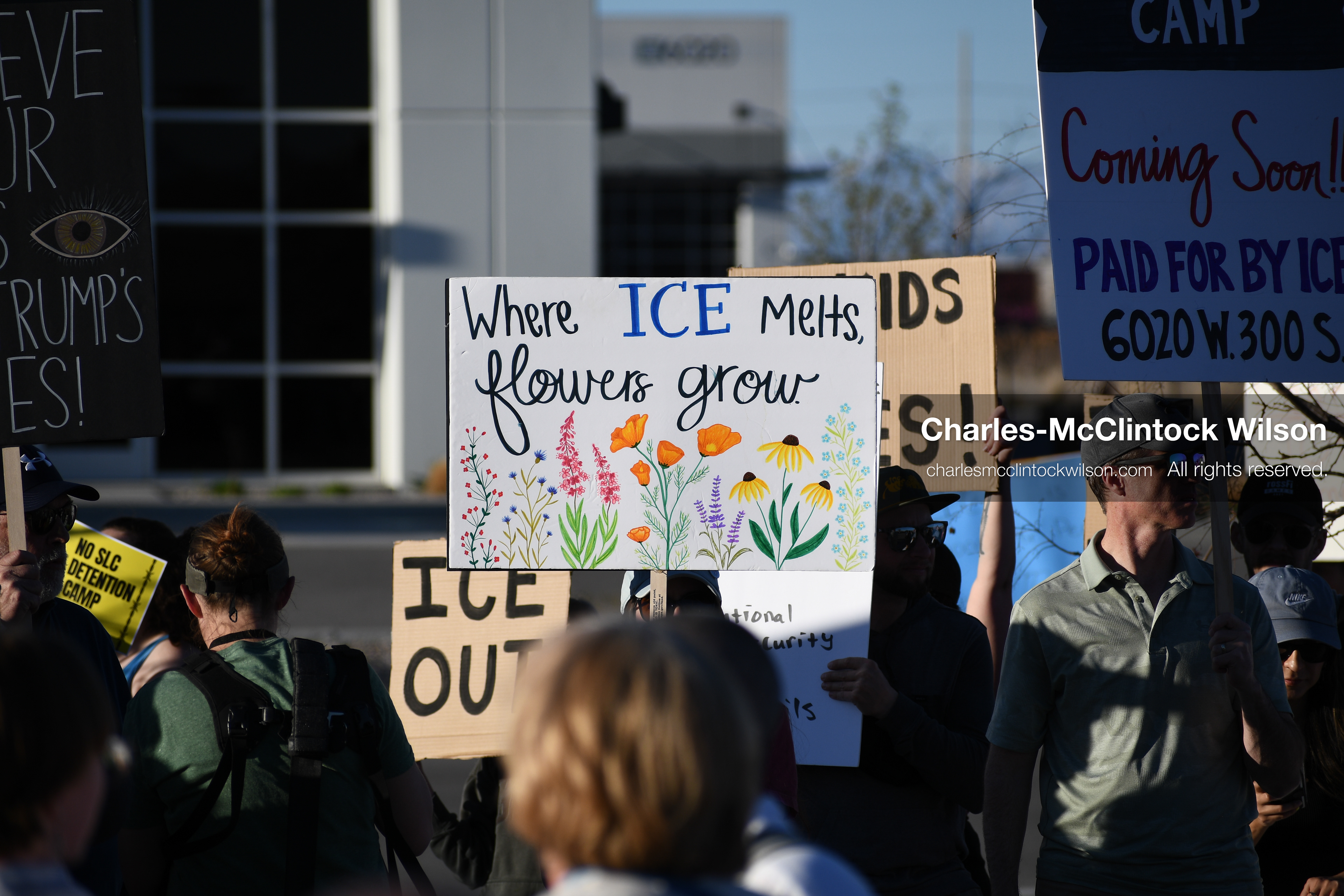 March 18, 2026, Salt Lake City, Utah, USA: People hold signs during a protest at the site of a proposed ICE detention facility on the west side of Salt Lake City. Demonstrators gathered near the warehouse property as part of an ongoing community response to the planned facility. (Credit Image: © Charles McClintock Wilson/ZUMA Press Wire)
