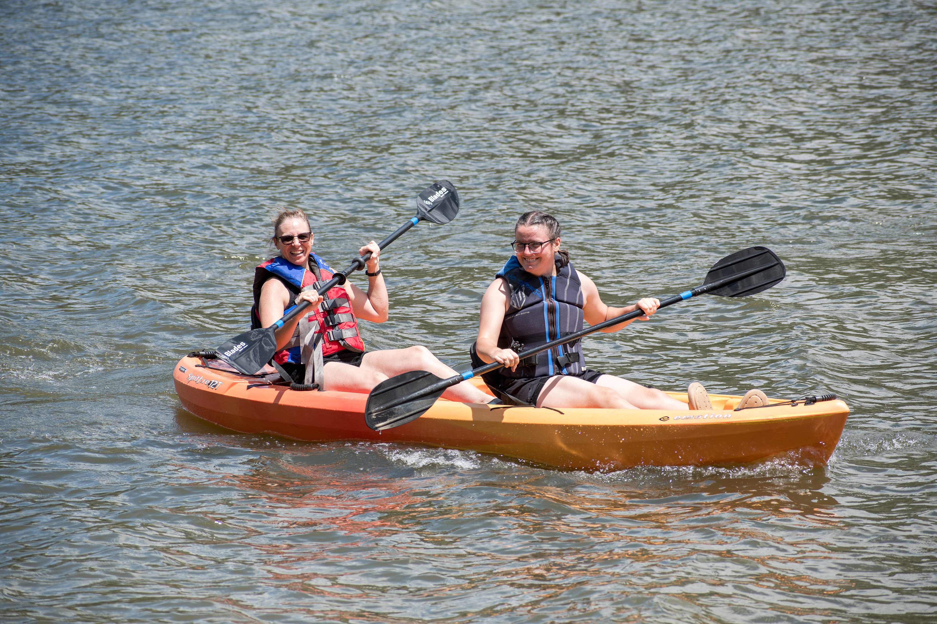 Summit County, Utah – July 20, 2025: People paddle kayaks across the calm waters of Smith and Morehouse Reservoir during a summer outing.