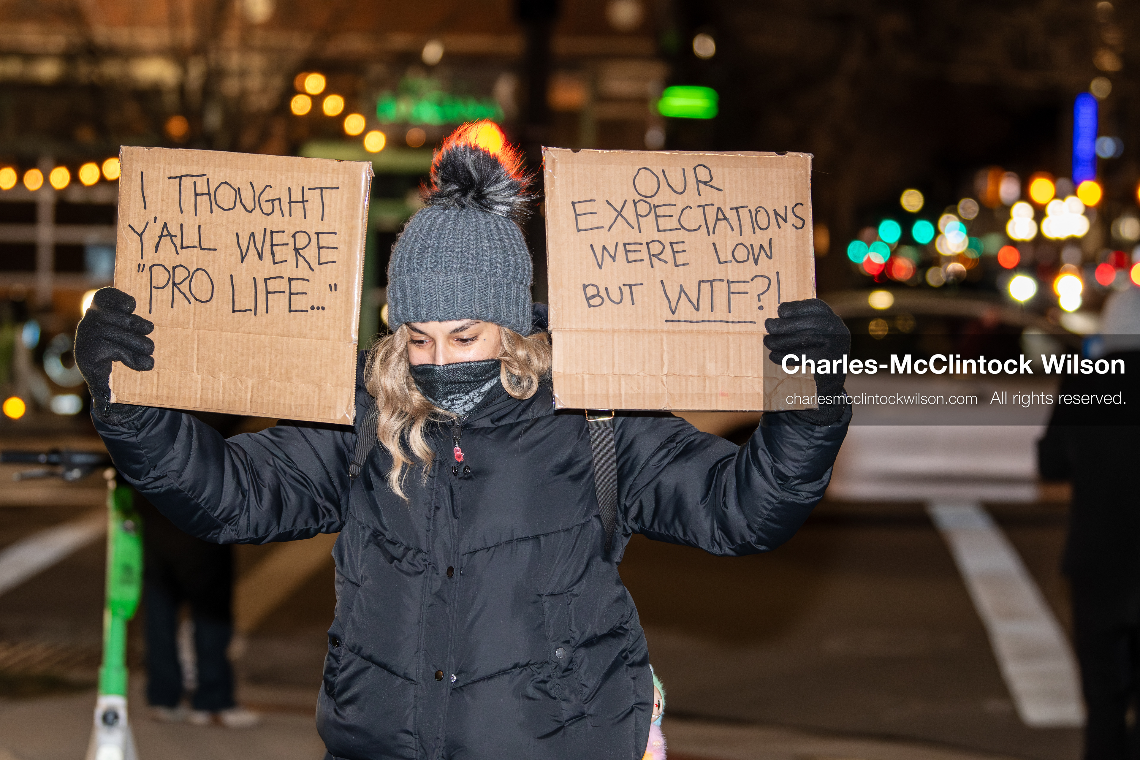 January 8, 2026, Salt Lake City, Utah, USA: A demonstrator holds two signs during an anti ICE protest at Pioneer Park in Salt Lake City Utah on Jan 8 2026. The rally followed the death of Renee Nicole Good a Minneapolis woman who was fatally shot during an encounter with immigration authorities and drew hundreds calling for accountability and changes to enforcement practices. (Credit Image: © Charles-McClintock Wilson/ZUMA Press Wire)