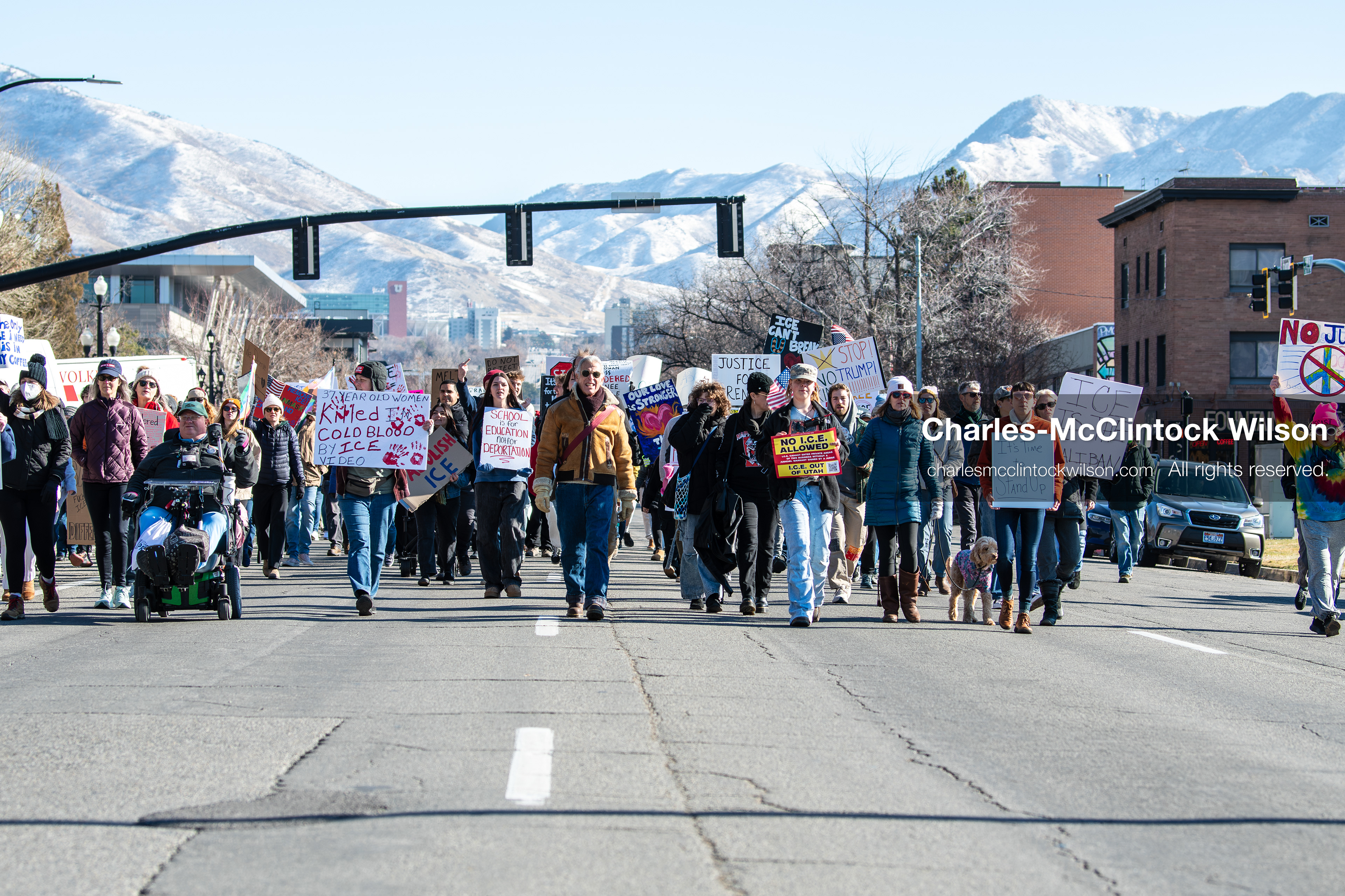 Salt Lake City, Utah, January 10, 2026: A group of demonstrators marches through downtown Salt Lake City during the ICE Out for Good protest, which began at Washington Square Park, with participants carrying signs and personal items as they walk together. (Credit Image: © Charles‑McClintock Wilson/ZUMA Press Wire)