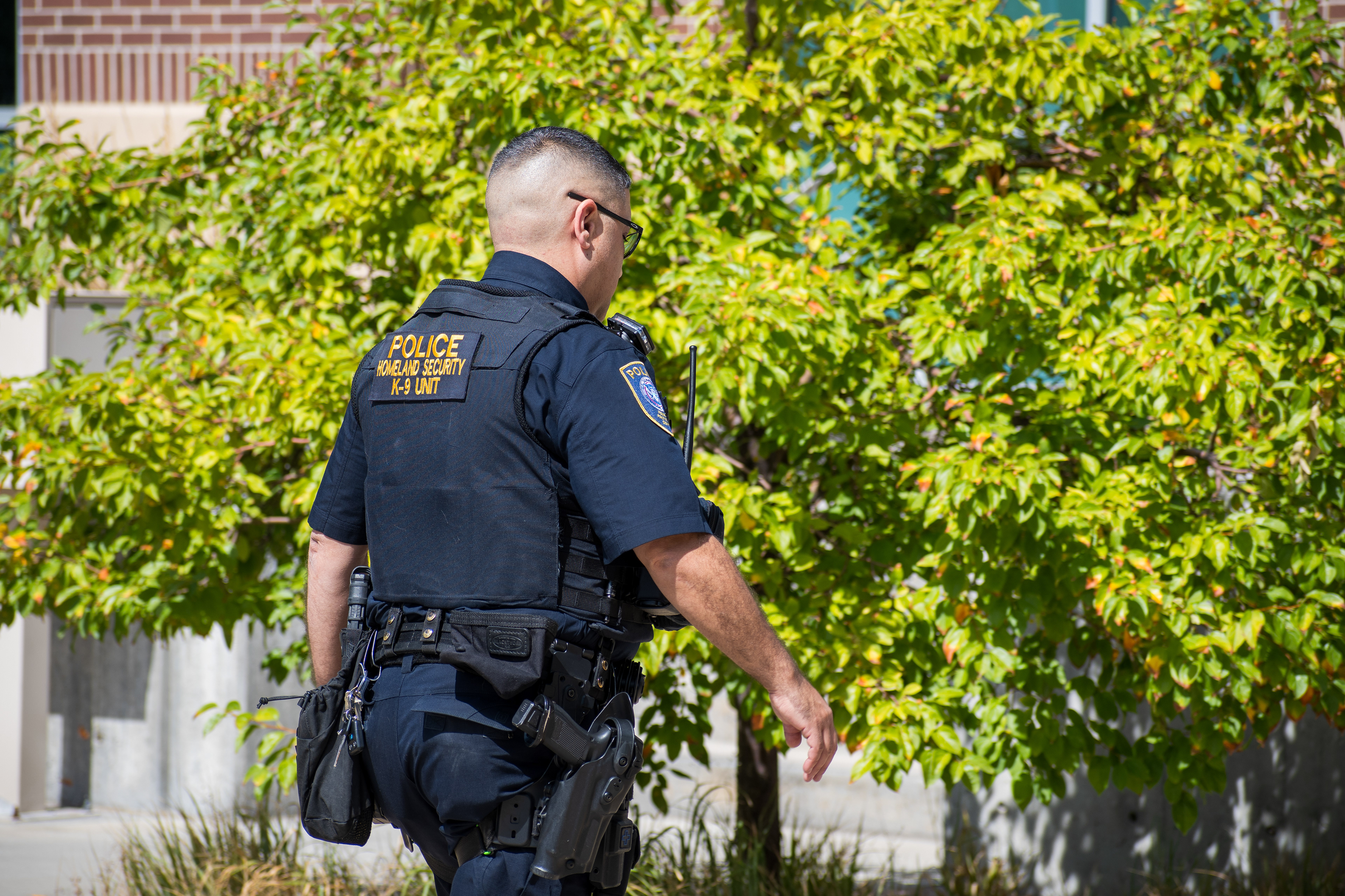 September 15, 2025 – Provo, Utah, United States: A Homeland Security police officer walks near the Utah Valley Convention Center during a Department of Homeland Security career expo focused on recruiting law enforcement and security personnel. Photograph by Charles‑McClintock Wilson / ZUMA Press Wire