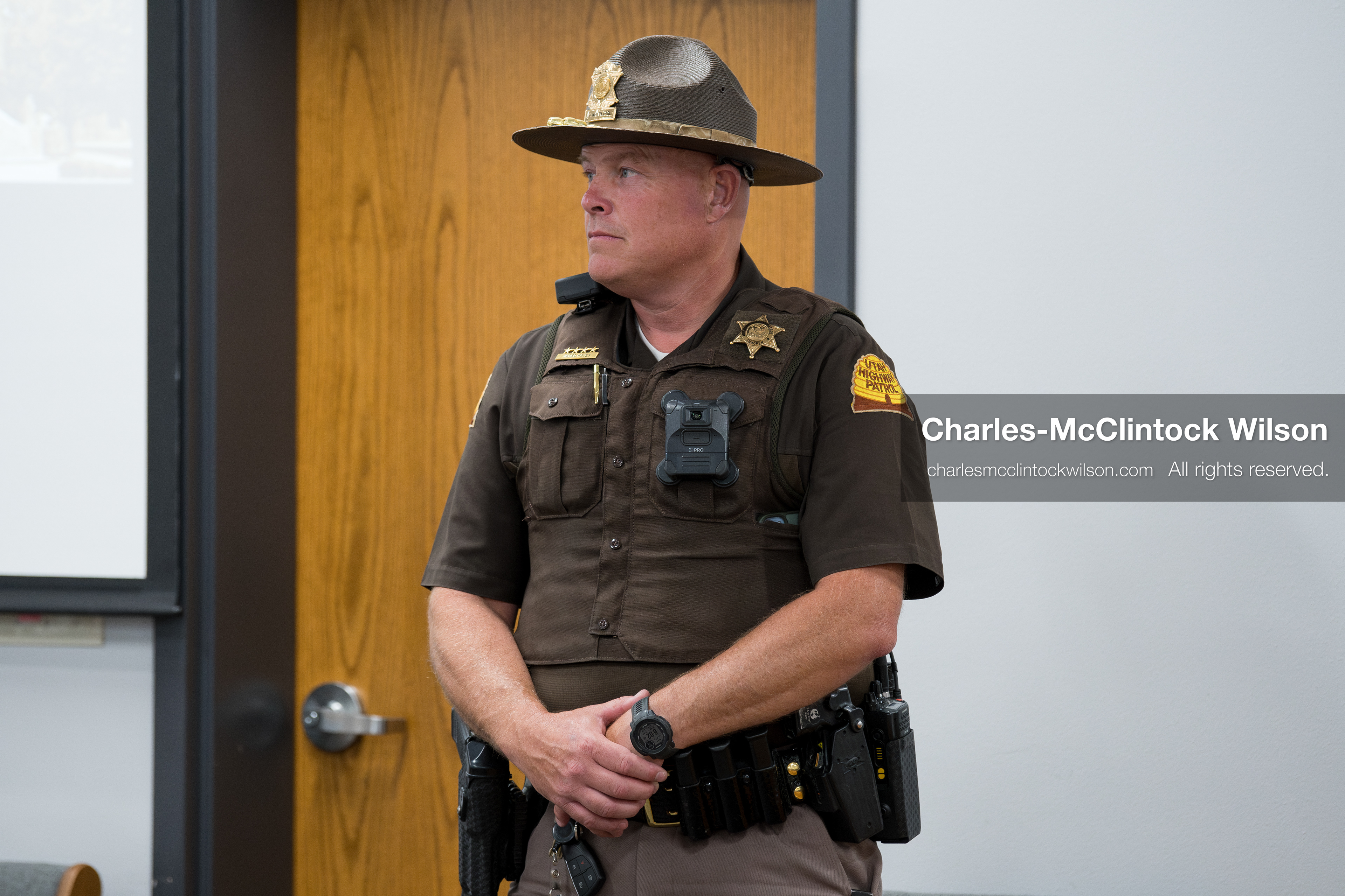 May 13, 2026, Brigham City, Utah, USA: A Utah Highway Patrol trooper stands inside the Box Elder County Justice Center in Brigham City, Utah, as residents gather for a public meeting over the proposed data‑center project backed by businessman Kevin O’Leary, which has drawn public concern over water use, power demand, and transparency. (Credit Image: © Charles‑McClintock Wilson/ZUMA Press Wire)