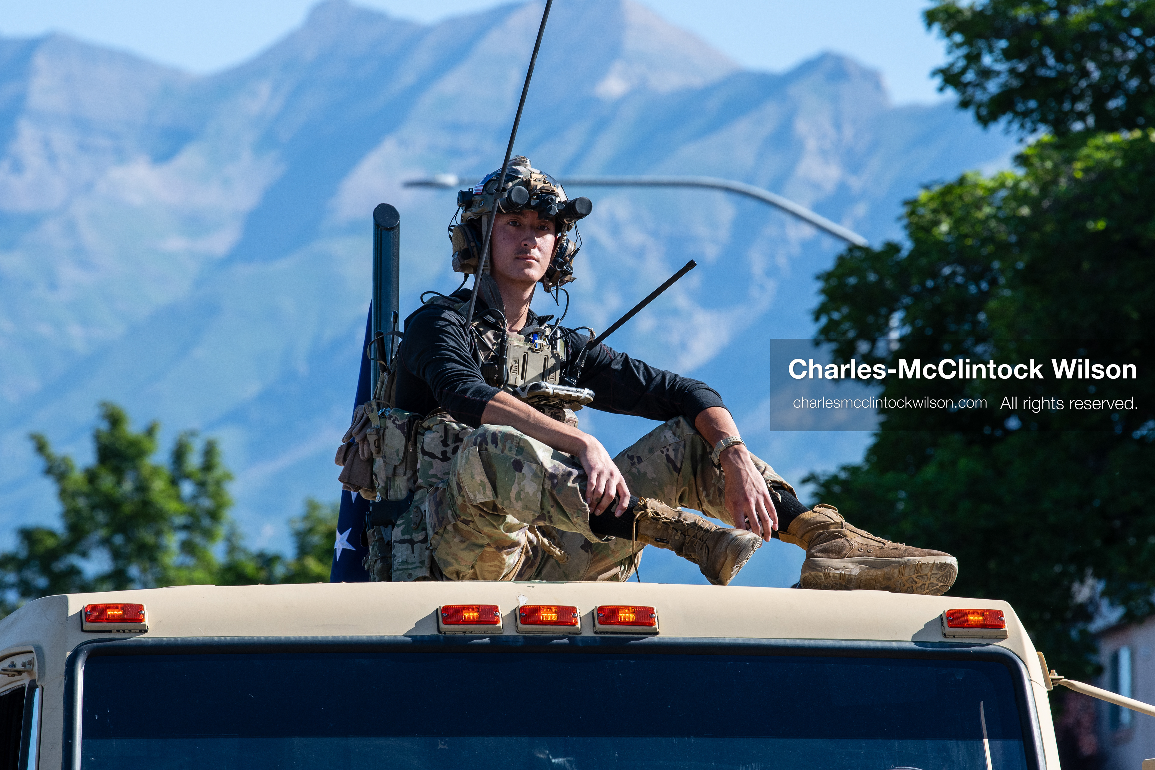 July 4, 2026, Provo, Utah, USA: A military service member sits atop a moving parade vehicle against a mountain backdrop during America's Freedom Festival Grand Parade in Provo, Utah, Saturday, July 4, 2026. The annual event drew thousands of spectators to the downtown corridor. (Credit Image: © Charles-McClintock Wilson/ZUMA Press Wire)