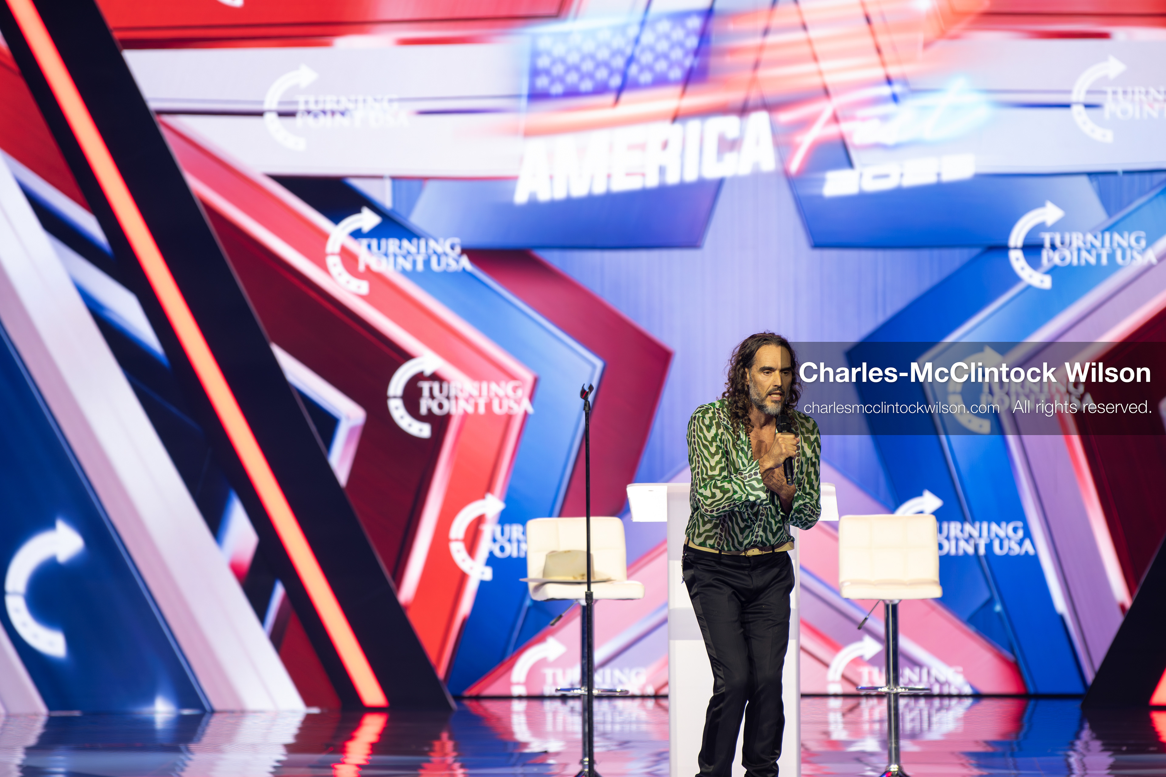 December 18, 2025, Phoenix, Arizona, USA: Russell Brand speaks during Day One of Turning Point USA’s AmericaFest 2025 at the Phoenix Convention Center in Phoenix, Arizona.   (Credit Image: © Charles‑McClintock Wilson/ZUMA Press Wire)