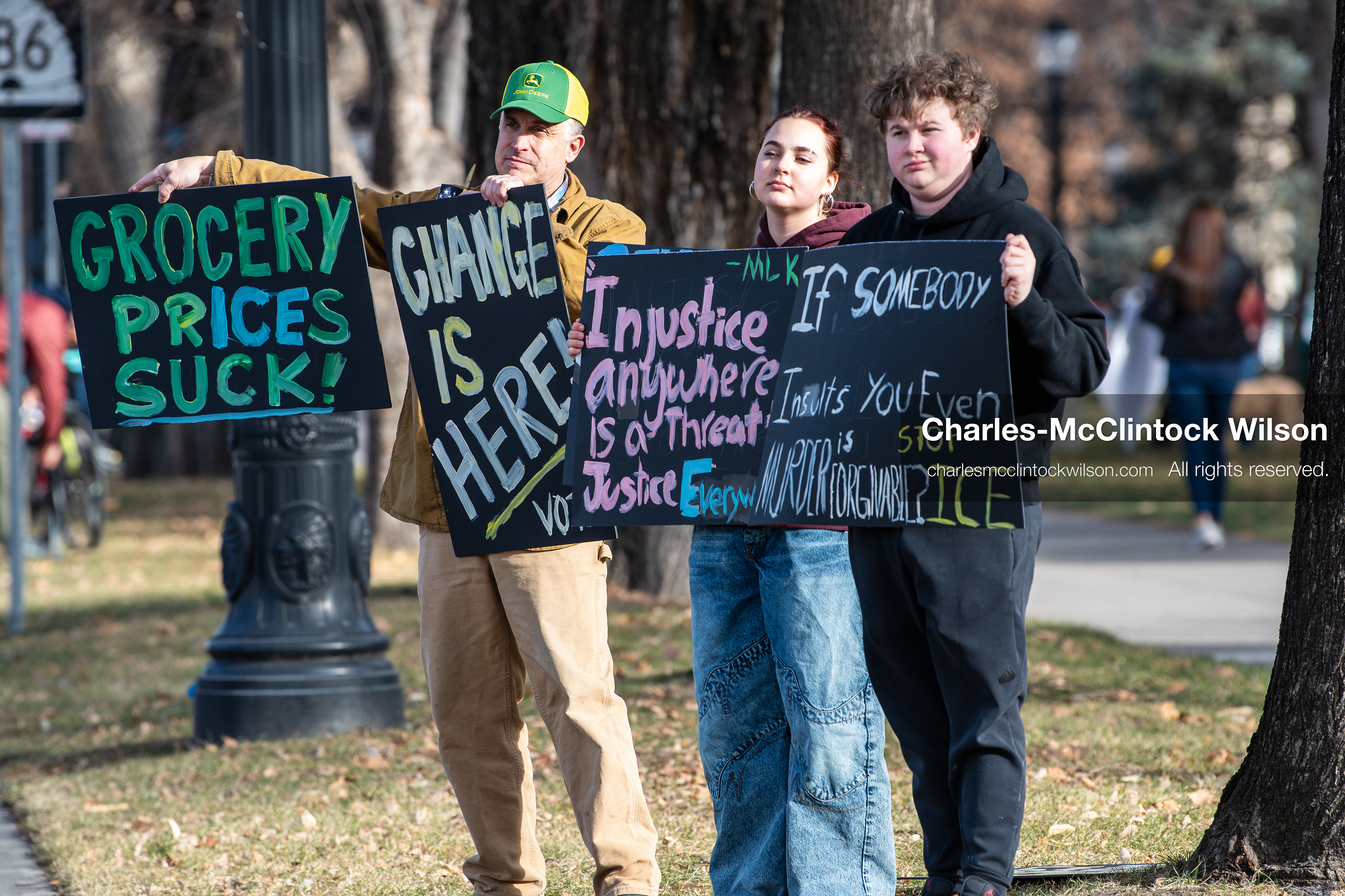 January 30, 2026, Salt Lake City, Utah, USA: Demonstrators hold signs on a sidewalk at Washington Square Park during an anti‑ICE protest in Salt Lake City, part of a nationwide response to immigration enforcement policies. (Credit Image: © Charles‑McClintock Wilson/ZUMA Press Wire)