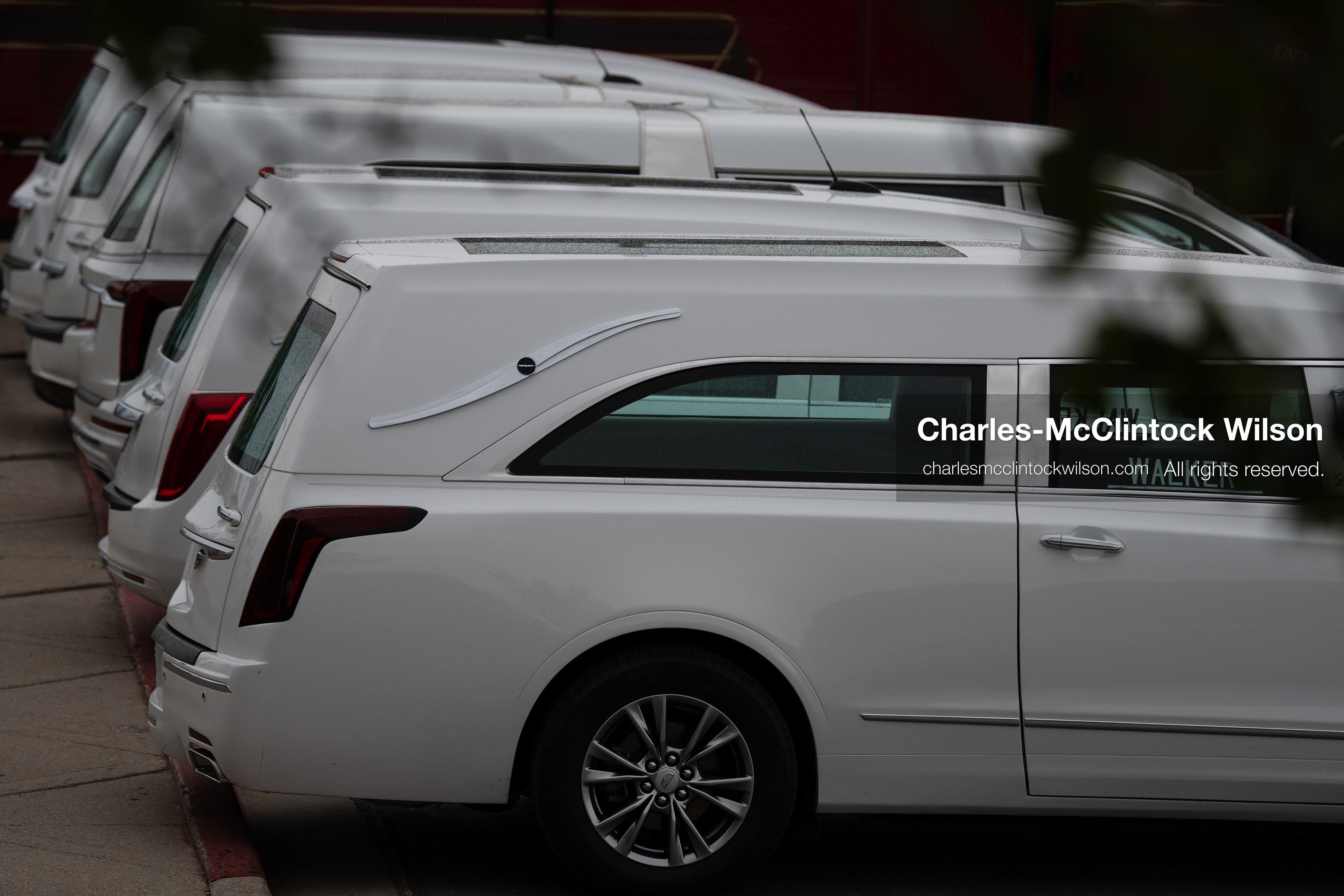 A close-up shot shows a line of white Cadillac hearses parked outside the UCCU Center at Utah Valley University in Orem, Utah, on Wednesday, July 29, 2026. More than 300 people came to the public memorial ceremony to honor Provo Fire Captain Spencer Long, his wife Katrina, and three of their sons, who died after a flash flood hit their campsite near the Sunglow Campground in Wayne County. (Photo by Charles-McClintock Wilson/Sipa USA)