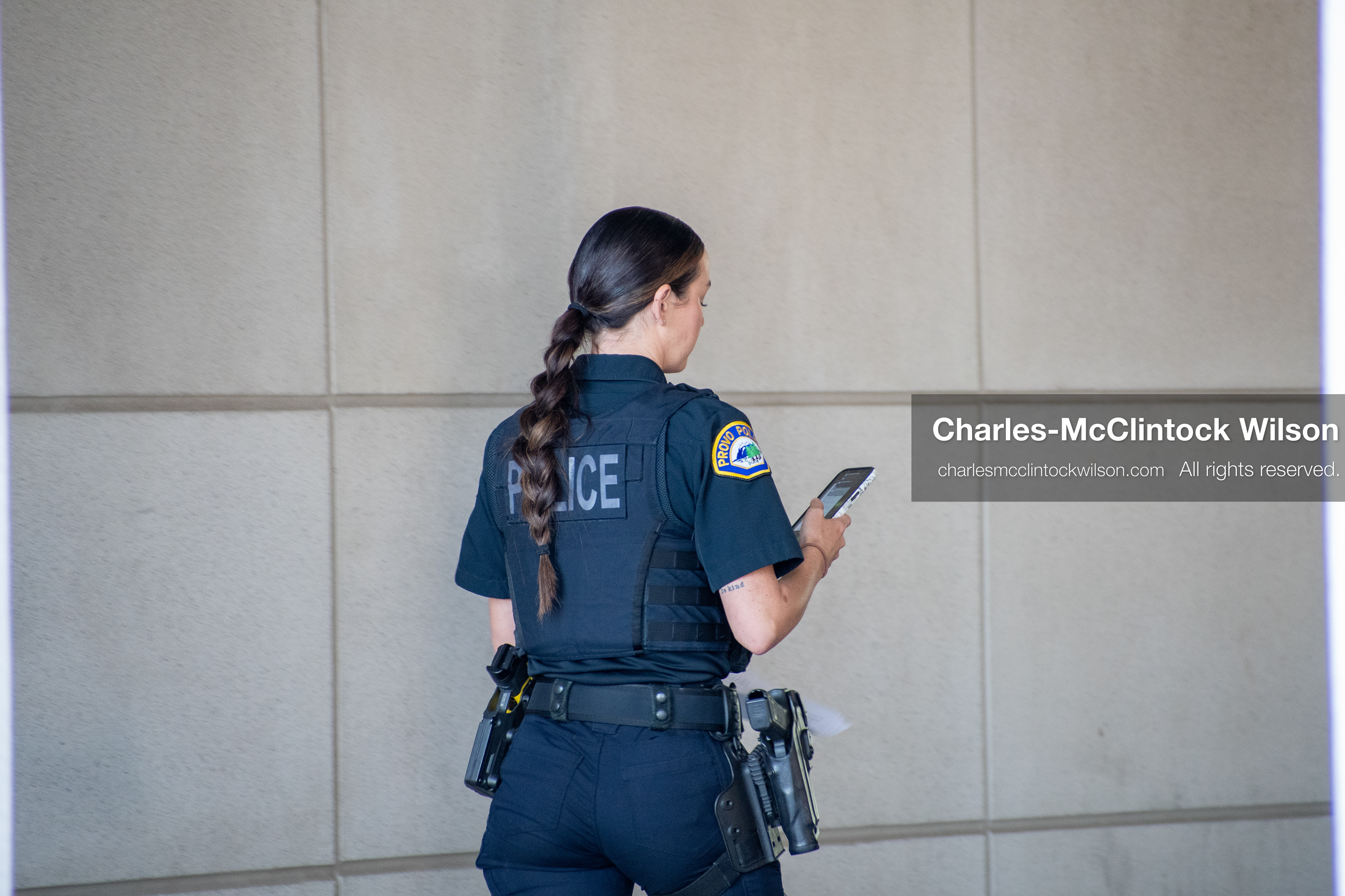 SEPTEMBER 29, 2025 — PROVO, UTAH, USA: A Provo Police Department officer walks outside the Utah County Court during a waiver hearing for Tyler Robinson. Robinson, charged with aggravated murder in the September 10 shooting death of conservative activist Charlie Kirk at Utah Valley University, appeared virtually for the proceedings. Law enforcement maintained a visible presence throughout the hearing. (Credit Image: © Charles‑McClintock Wilson / ZUMA Press Wire)