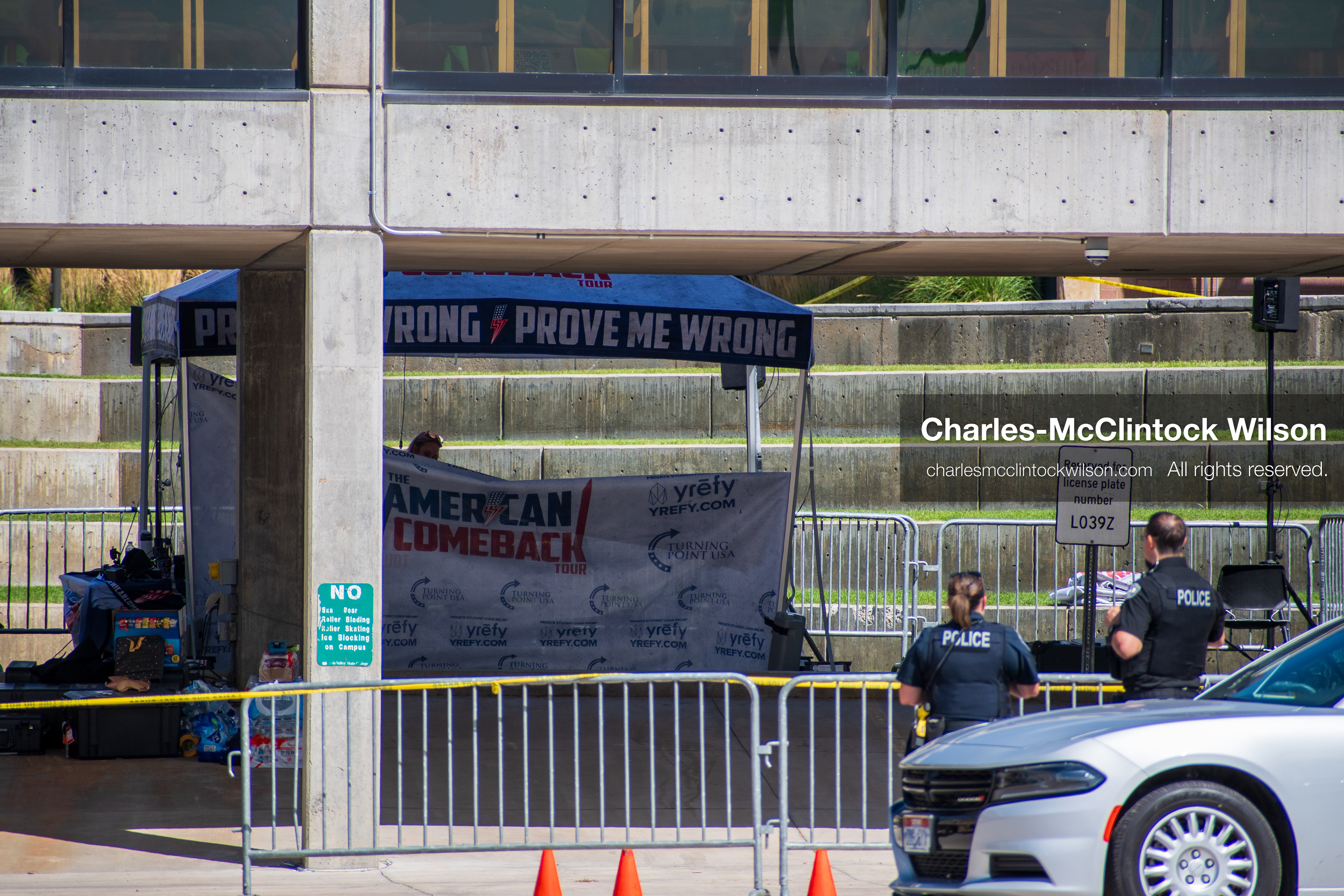 September 12, 2025, Orem, Utah, USA: Investigators and police officers secure the canopy-covered courtyard at Utah Valley University in Orem, Utah, where conservative activist CHARLIE KIRK was fatally shot during a public speaking event on September 10, 2025. KIRK, CEO of Turning Point USA, was seated beneath the canopy when a single bullet struck him in the neck.   (Credit Image: © Charles‑McClintock Wilson/ZUMA Press Wire)