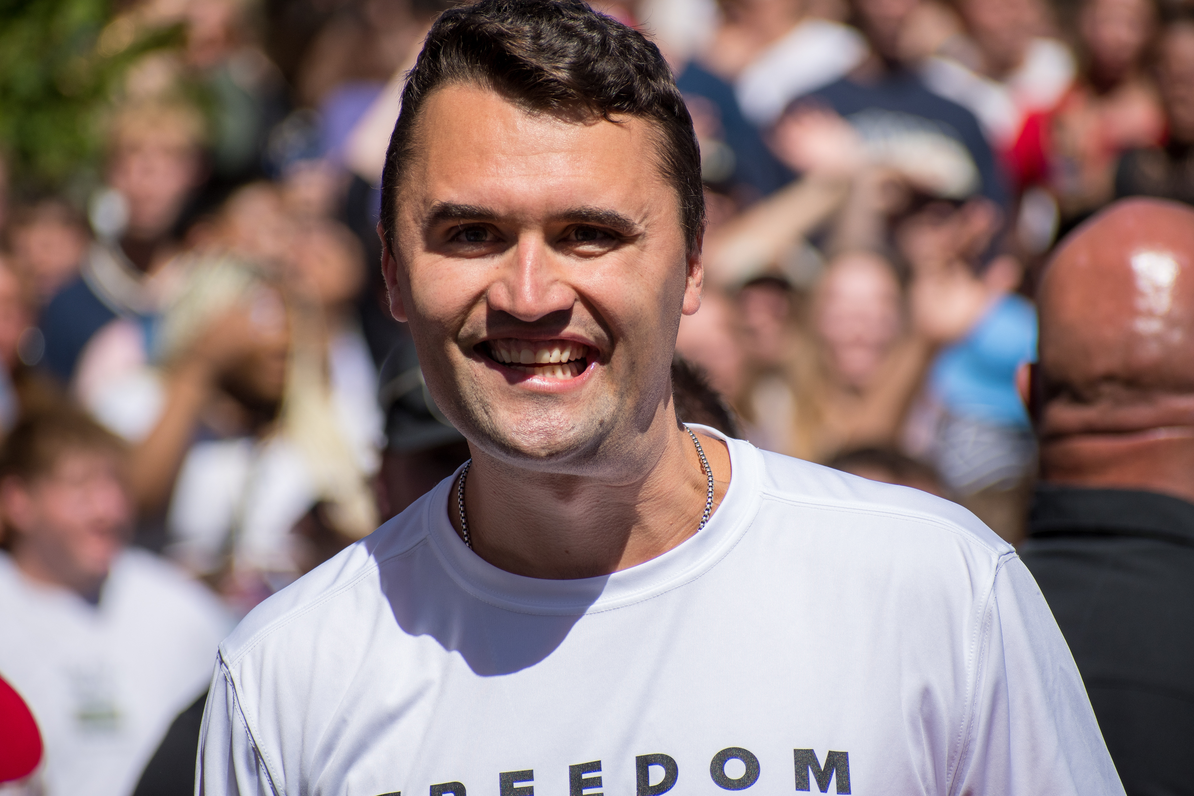 OREM, UTAH – SEPTEMBER 10, 2025: Charlie Kirk speaks with attendees during a public event at Utah Valley University. Positioned near a promotional booth and surrounded by supporters, Kirk appears engaged and expressive in one of his final public moments. The image reflects the atmosphere of direct outreach and energized dialogue that defined the gathering. © Charles-McClintock Wilson / ZUMA Press