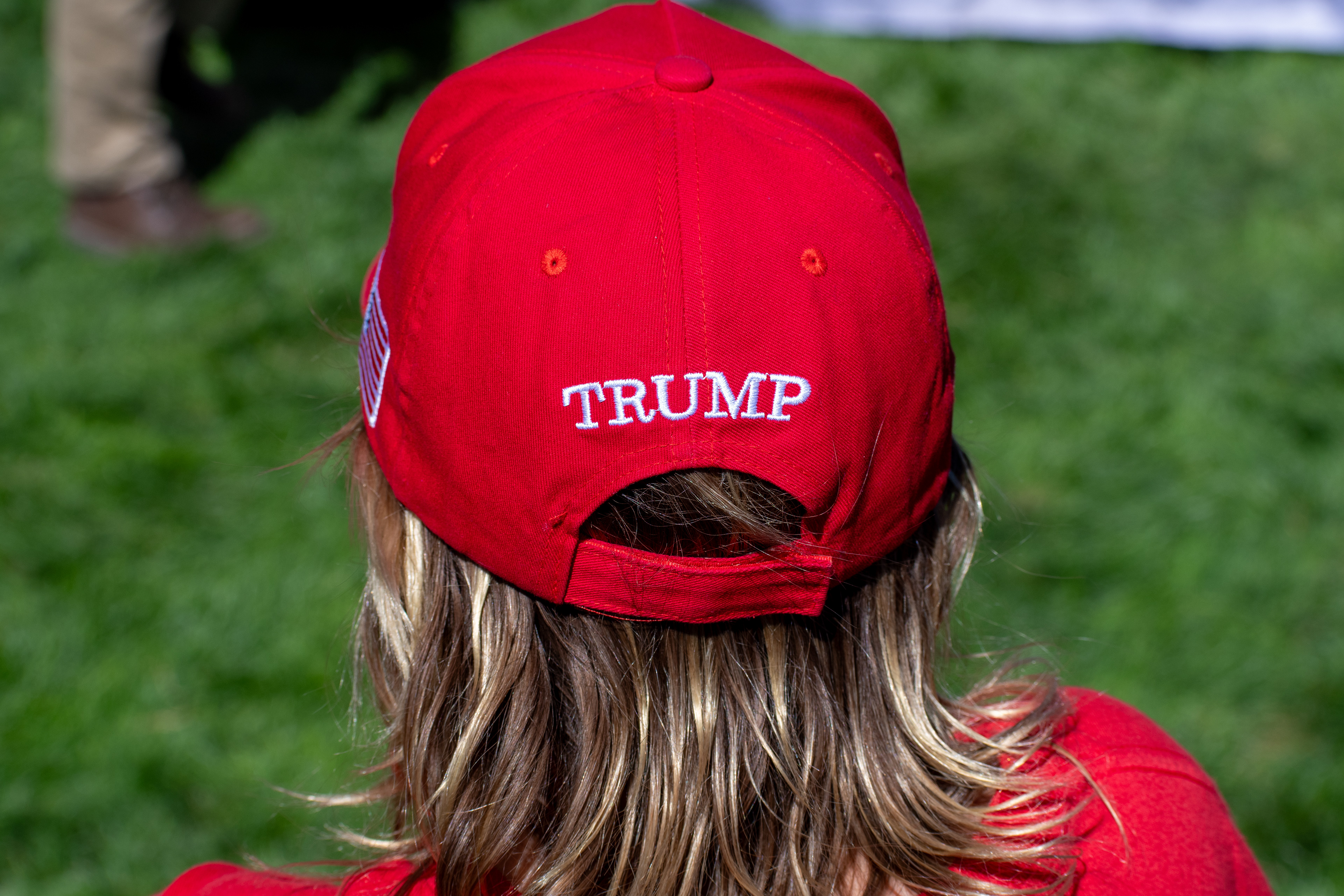 OREM, UTAH – SEPTEMBER 10, 2025: An attendee stands quietly on the lawn at Utah Valley University during the opening stop of the American Comeback Tour. Framed from behind, the image captures a moment of stillness and personal presence amid the larger gathering. It reflects the emotional texture and civic anticipation that shaped the event’s intended spirit. © Charles-McClintock Wilson / ZUMA Press