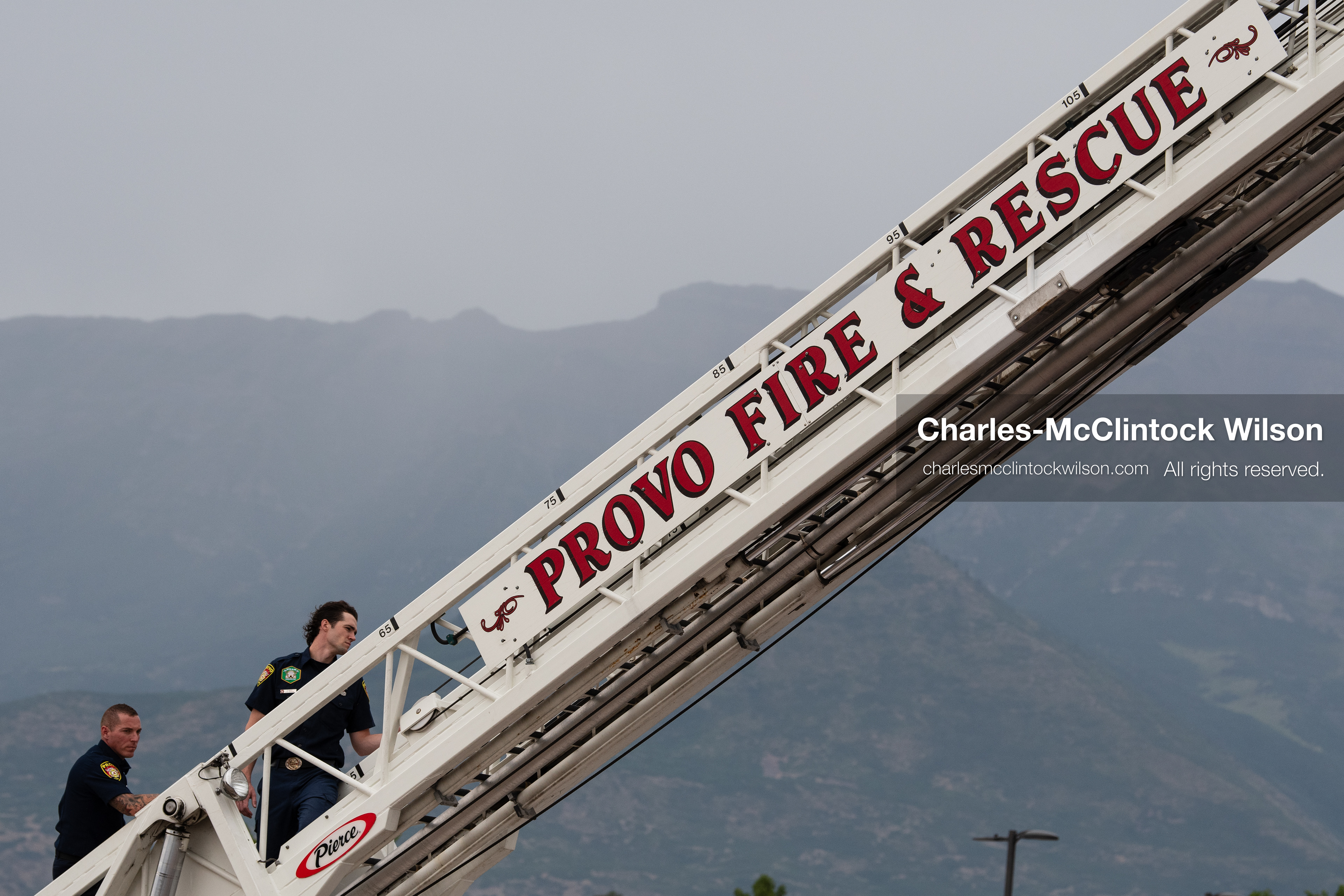 First responders work on an extended Provo Fire & Rescue ladder truck outside the UCCU Center at Utah Valley University in Orem, Utah, on Wednesday, July 29, 2026. More than 300 people came to the public memorial ceremony to honor Provo Fire Captain Spencer Long, his wife Katrina, and three of their sons, who died after a flash flood hit their campsite near the Sunglow Campground in Wayne County. (Photo by Charles-McClintock Wilson/Sipa USA)