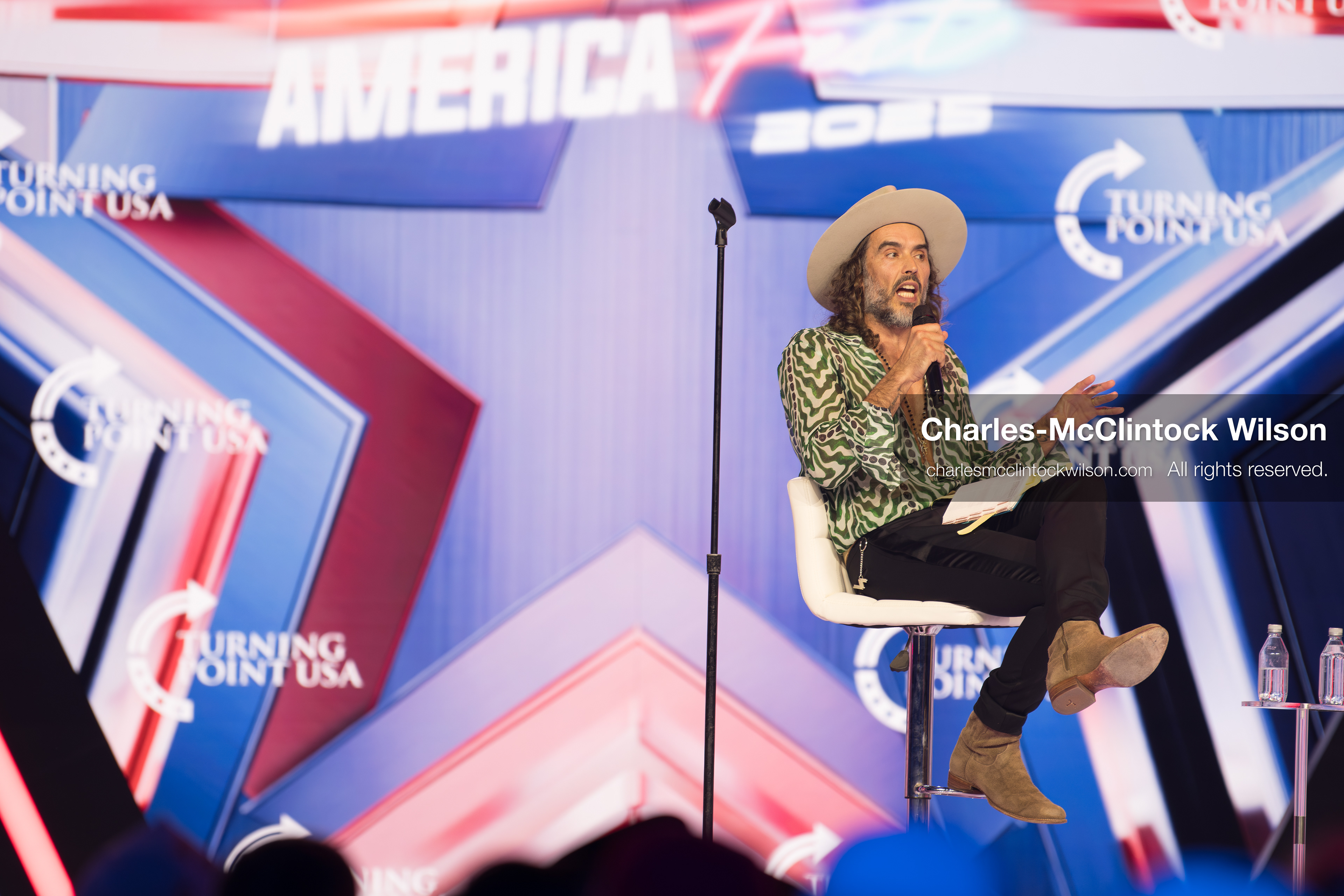 December 18, 2025, Phoenix, Arizona, USA: Russell Brand speaks during Day One of Turning Point USA’s AmericaFest 2025 at the Phoenix Convention Center in Phoenix, Arizona.   (Credit Image: © Charles‑McClintock Wilson/ZUMA Press Wire)