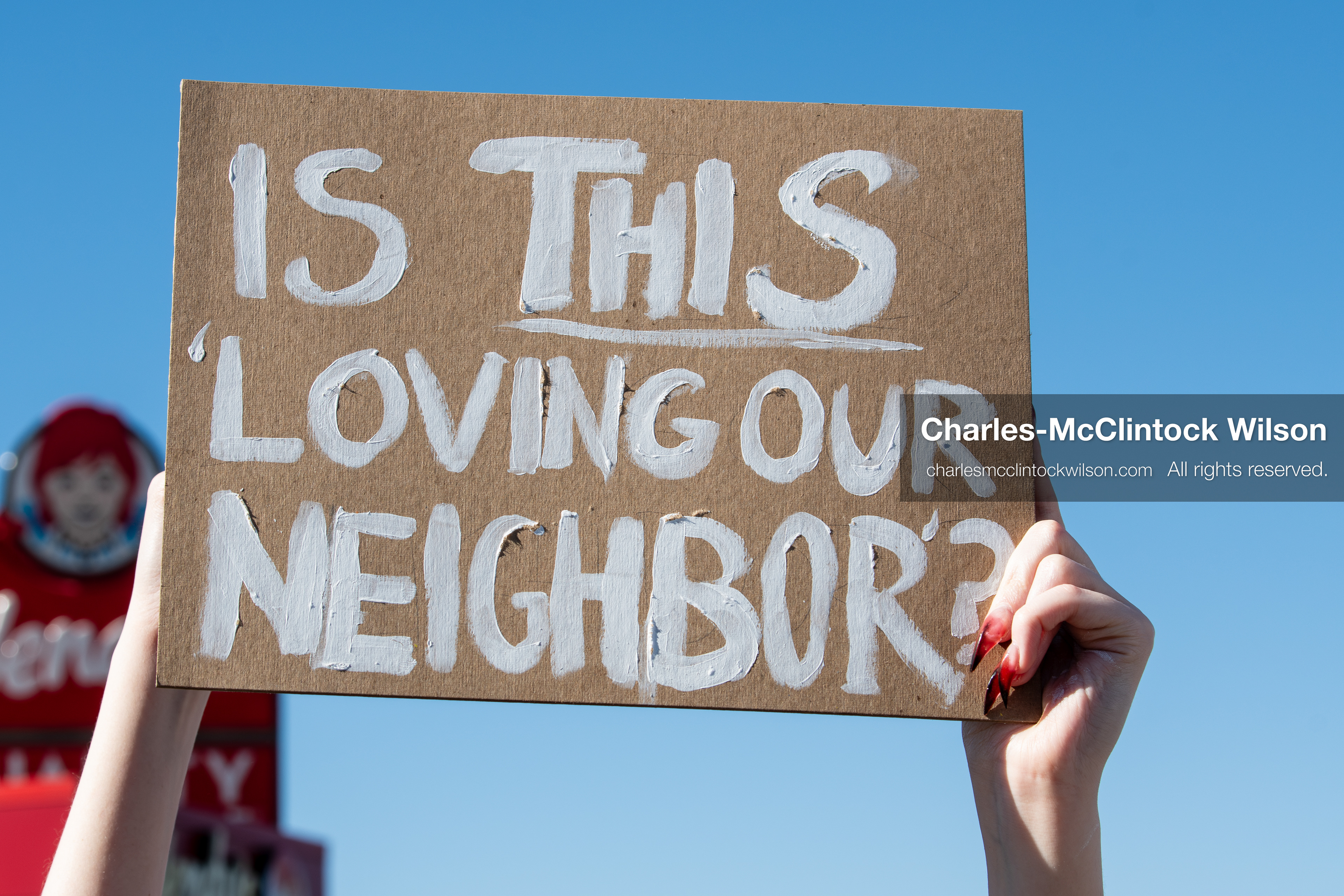 February 5, 2026, Provo, Utah, USA: A demonstrator holds a sign during a gathering near Brigham Young University in Provo where students and community members protested the presence of US Customs and Border Protection recruiters at a career fair held on the BYU campus. (Credit Image: © Charles McClintock Wilson/ZUMA Press Wire)