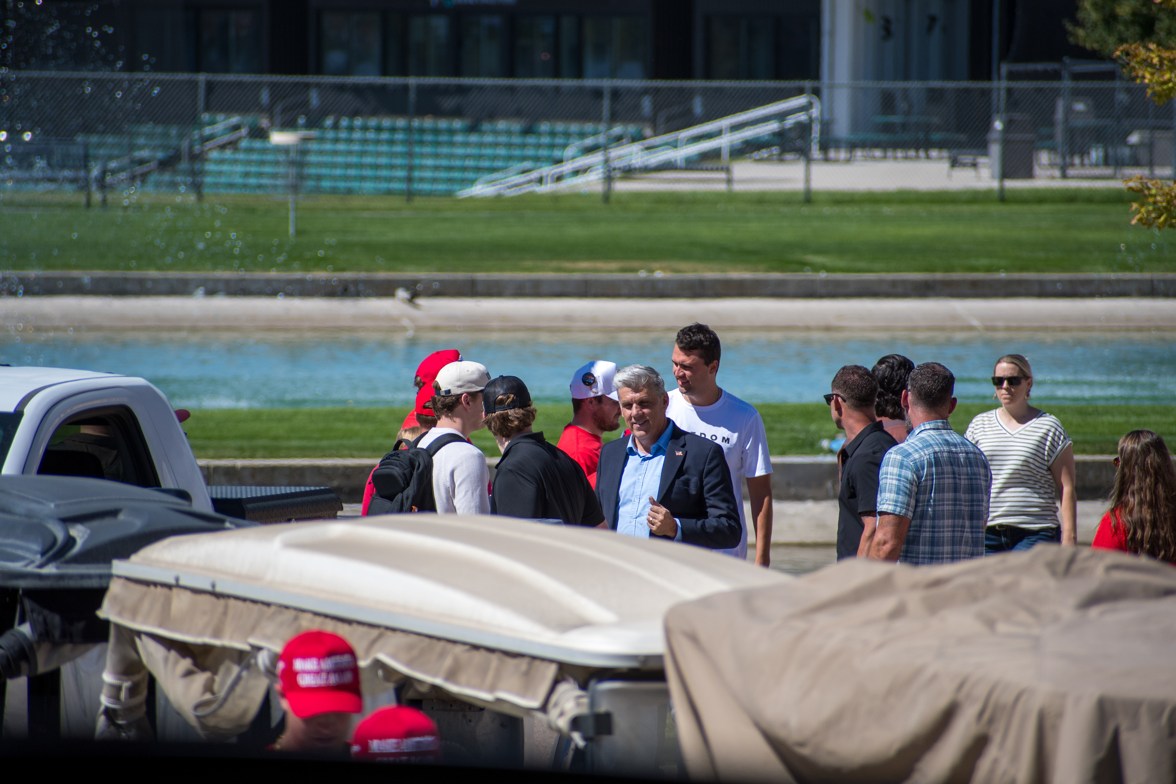 OREM, UTAH – SEPTEMBER 10, 2025: Charlie Kirk arrives at Utah Valley University for a scheduled public event. Walking near a water feature and surrounded by staff and supporters, Kirk enters the venue in a moment of calm anticipation. The image marks the beginning of his final public appearance, reflecting the quiet buildup before the crowd engagement that followed. © Charles-McClintock Wilson / ZUMA Press