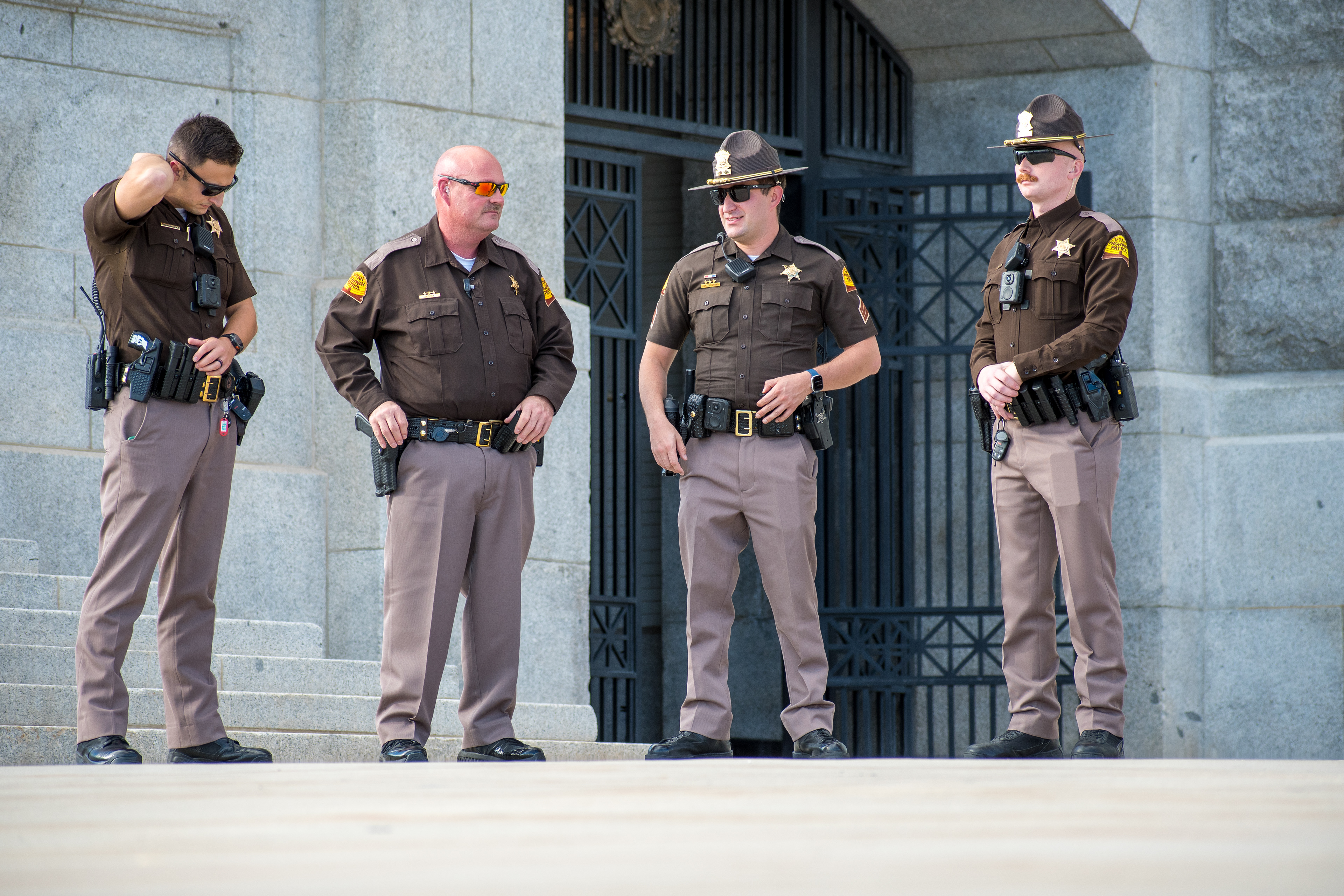 October 10, 2025, Salt Lake City, Utah, USA: Utah Highway Patrol officers stand near a stone structure during the Free Palestine Rally at the Utah State Capitol. The group appears to confer while equipped with standard gear. (Credit Image: © Charles-McClintock Wilson/ZUMA Press Wire)