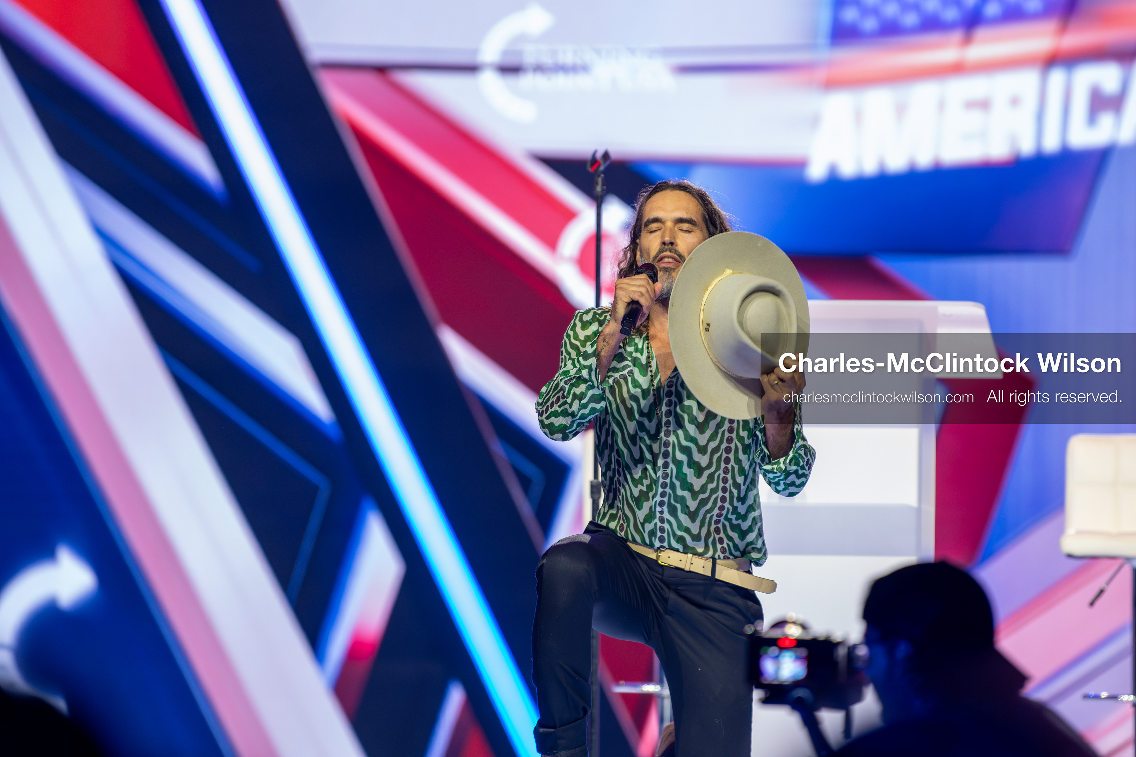 December 18, 2025, Phoenix, Arizona, USA: Russell Brand speaks during Day One of Turning Point USA’s AmericaFest 2025 at the Phoenix Convention Center in Phoenix, Arizona.   (Credit Image: © Charles‑McClintock Wilson/ZUMA Press Wire)