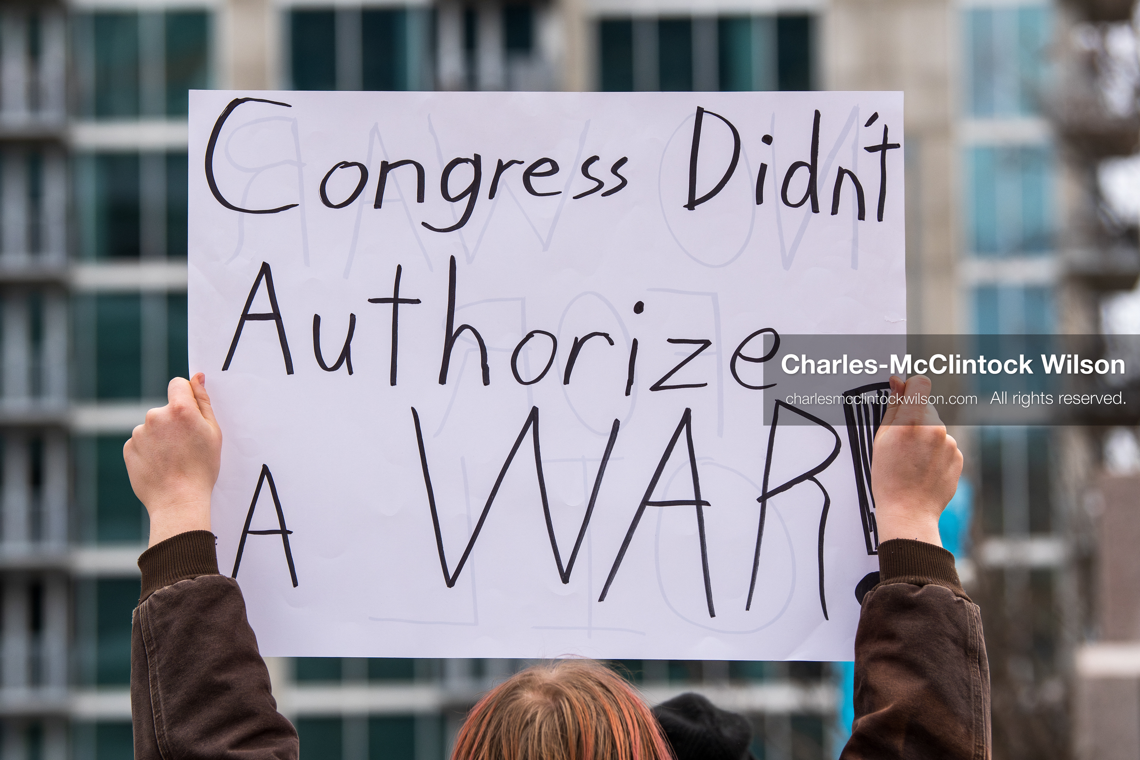 January 3, 2026, Salt Lake City, Utah, USA: A protester holds a sign during a demonstration against US action in Venezuela outside the Wallace Federal Building in Salt Lake City, Utah. The protest was part of a nationwide mobilization responding to recent military developments. (Credit Image: (c) Charles‑McClintock Wilson/ZUMA Press Wire)