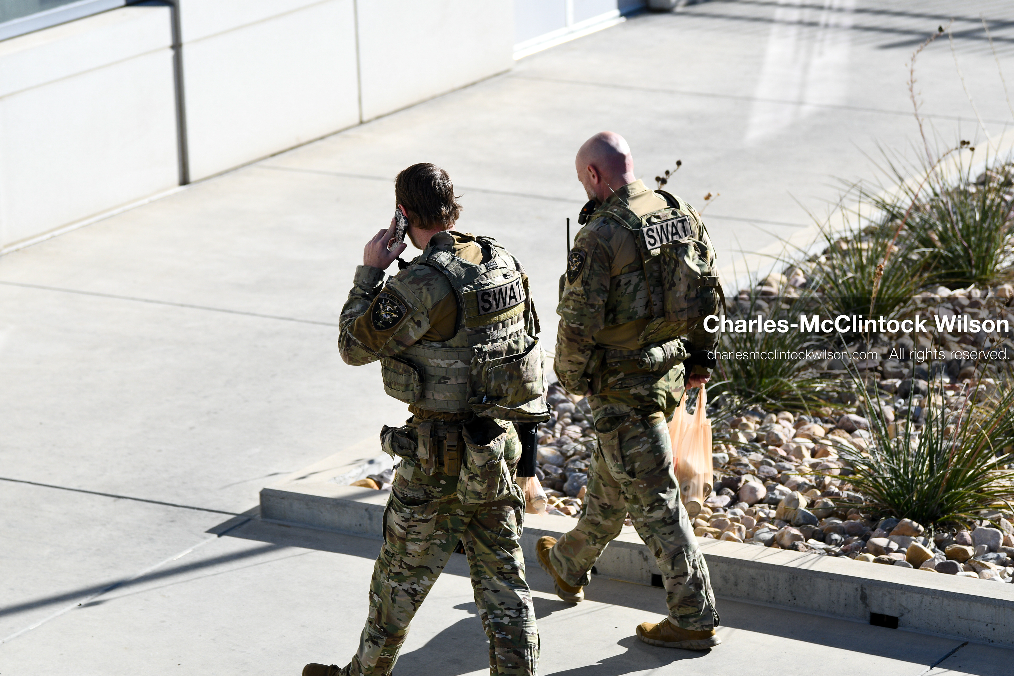 PROVO, UTAH, USA – DECEMBER 11, 2025: Two SWAT members walk near the Fourth District Court in Provo during the first in‑person court appearance of Tyler Robinson in the Charlie Kirk murder case. (Credit Image: © Charles‑McClintock Wilson/ZUMA Press Wire)