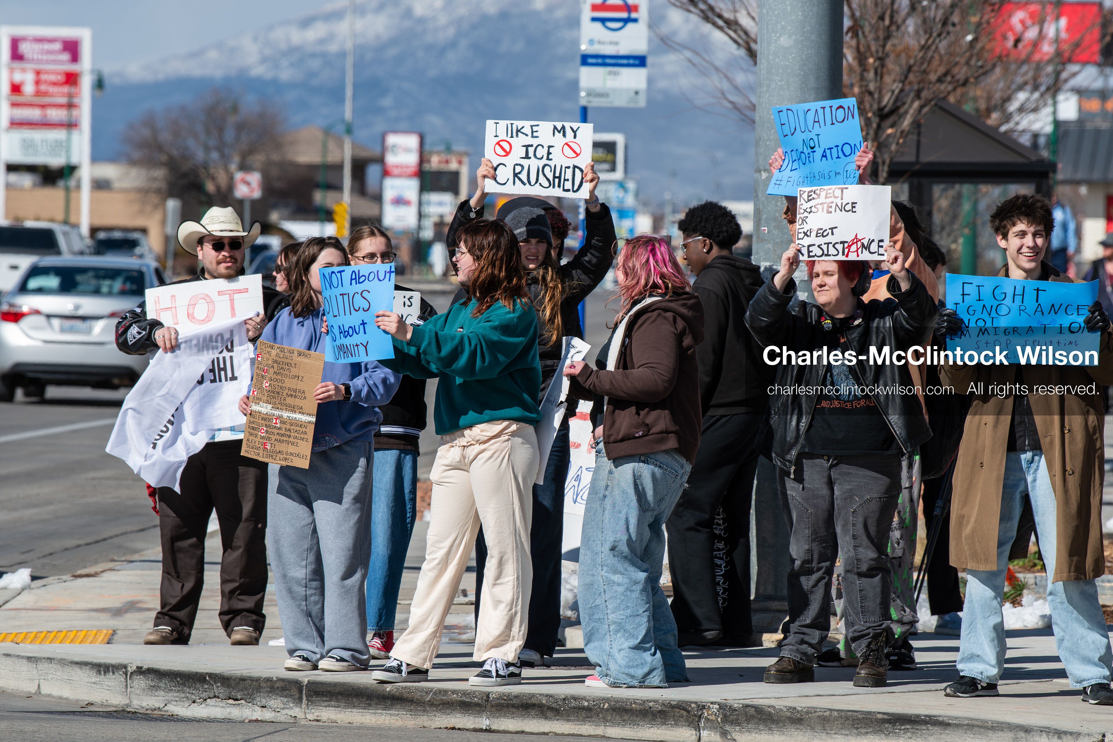 February 20, 2026, Orem, Utah, USA: High school students gather along State Street in front of Orem City Hall during a student led protest against ICE and federal immigration enforcement. Demonstrators hold signs as they stand near the roadway while traffic continues through the area. (Credit Image: © Charles McClintock Wilson/ZUMA Press Wire)