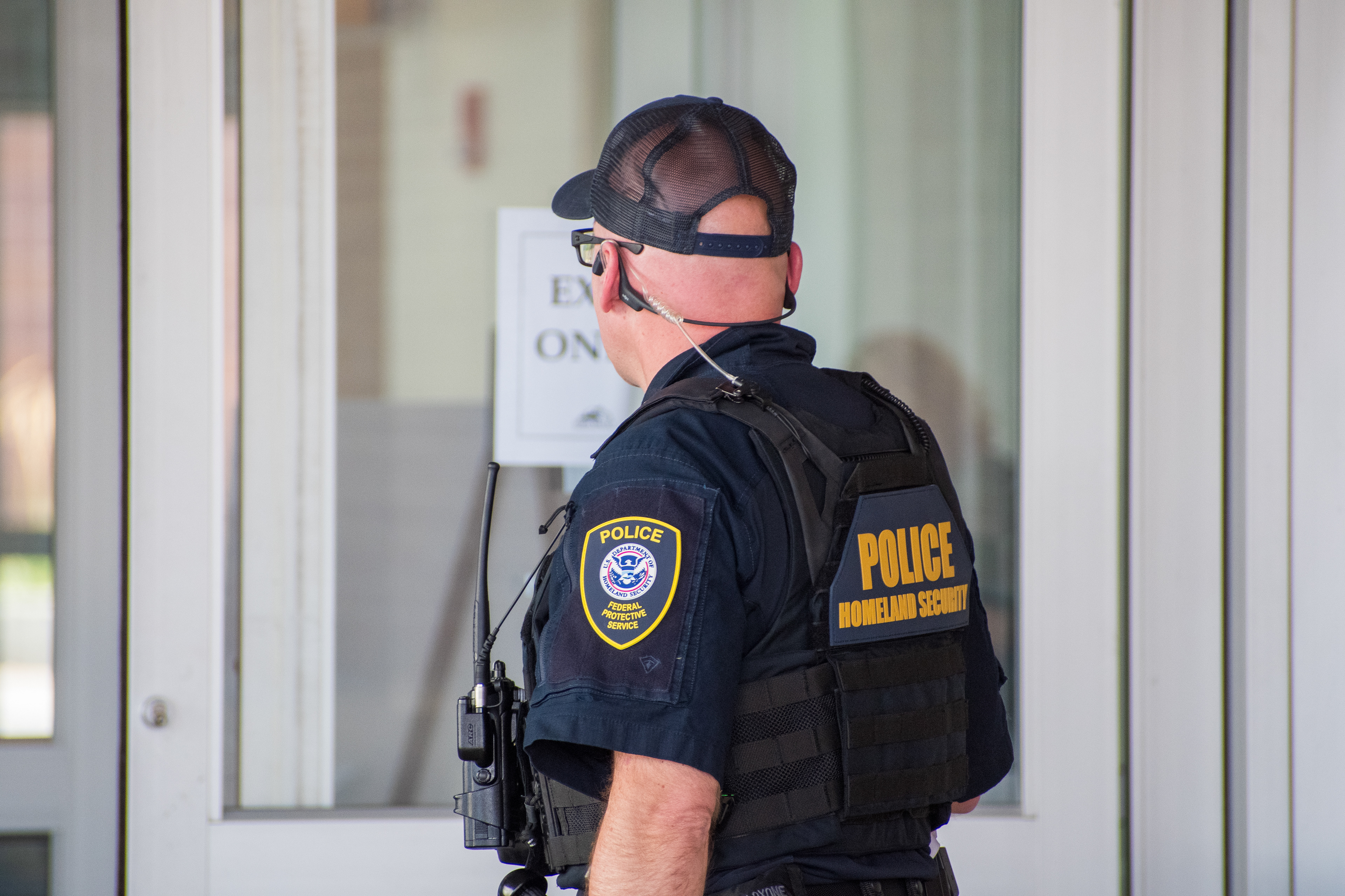 September 15, 2025 – Provo, Utah, United States: A Homeland Security police officer stands near a glass door marked “EXIT ONLY” at the Utah Valley Convention Center during a Department of Homeland Security career expo focused on recruiting law enforcement and security personnel. Photograph by Charles‑McClintock Wilson / ZUMA Press Wire