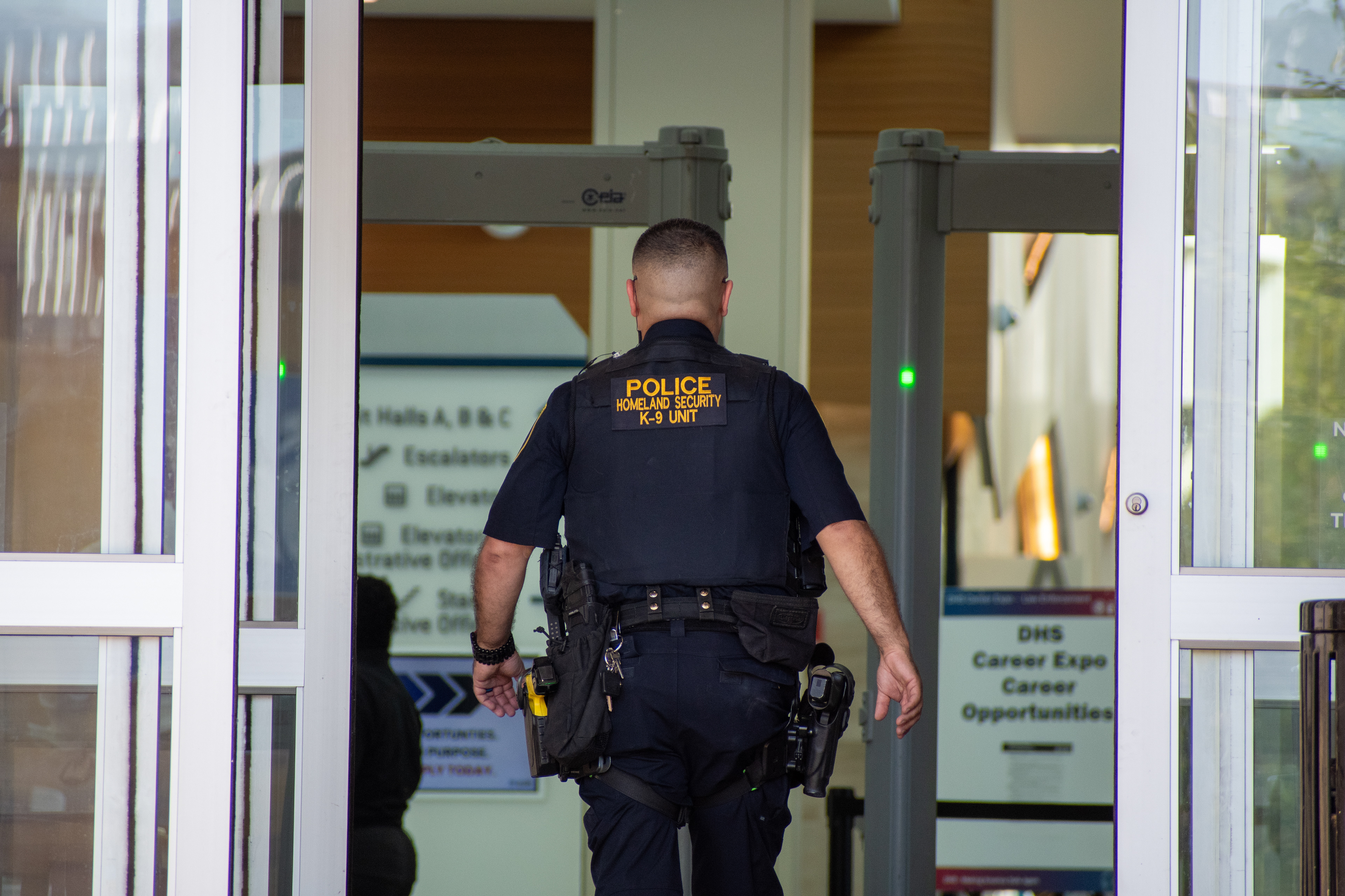 September 15, 2025 – Provo, Utah, United States: A Homeland Security police officer enters the Utah Valley Convention Center through a security checkpoint during a Department of Homeland Security career expo focused on recruiting law enforcement and security personnel. Photograph by Charles‑McClintock Wilson / ZUMA Press Wire