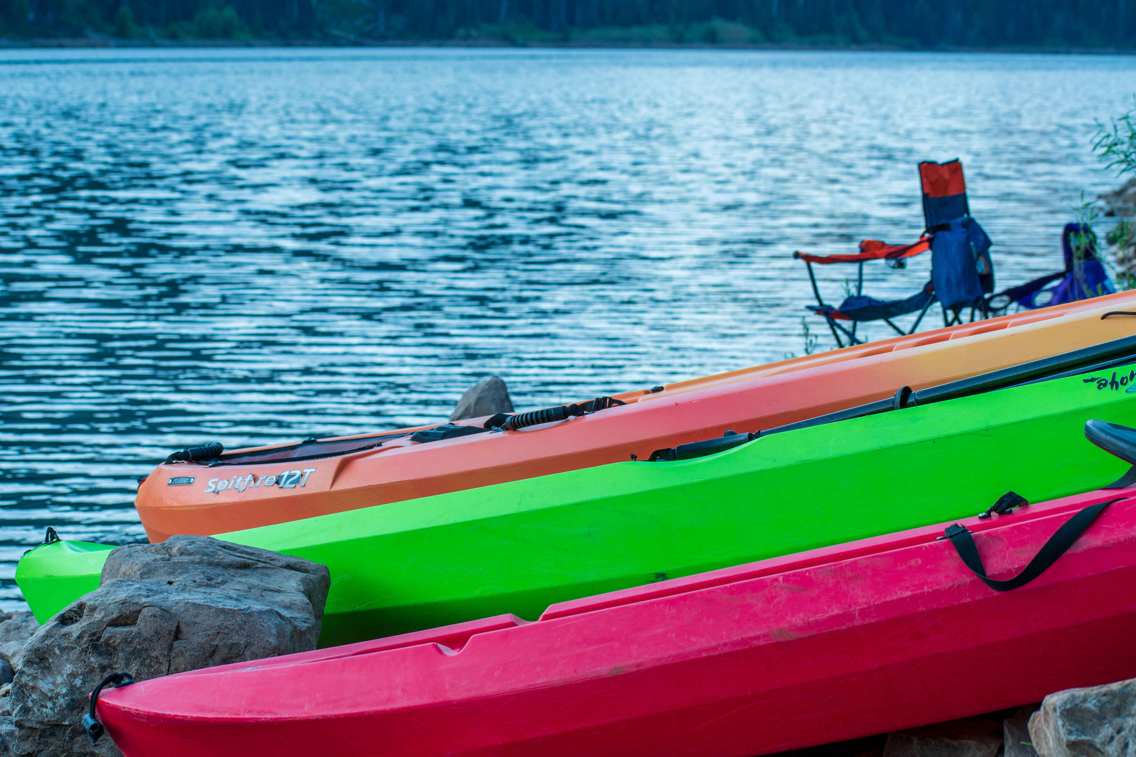 Summit County, Utah – July 20, 2025: Kayaks are stationed along the edge of Smith and Morehouse Reservoir, ready for use on a clear summer day.