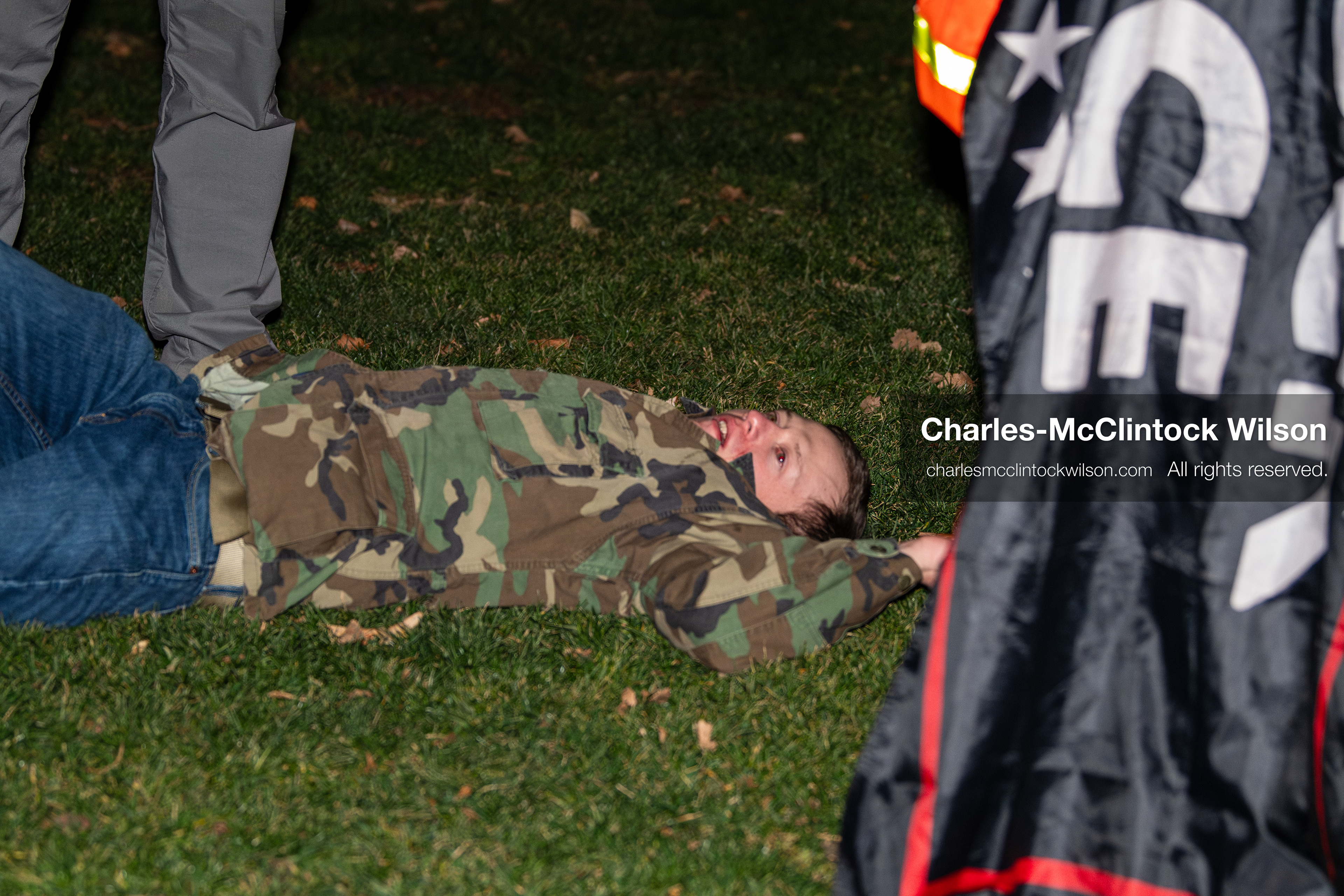January 8, 2026, Salt Lake City, Utah, USA: A demonstrator lies on the ground after being hurt during a confrontation at an anti ICE protest at Pioneer Park in Salt Lake City Utah on Jan 8 2026. The individual is a supporter of US president Donald Trump and is being assisted by law enforcement at the scene. The rally followed the death of Renee Nicole Good during an encounter with immigration authorities in Minneapolis and drew hundreds calling for accountability and changes to enforcement practices. (Credit Image: © Charles-McClintock Wilson/ZUMA Press Wire)