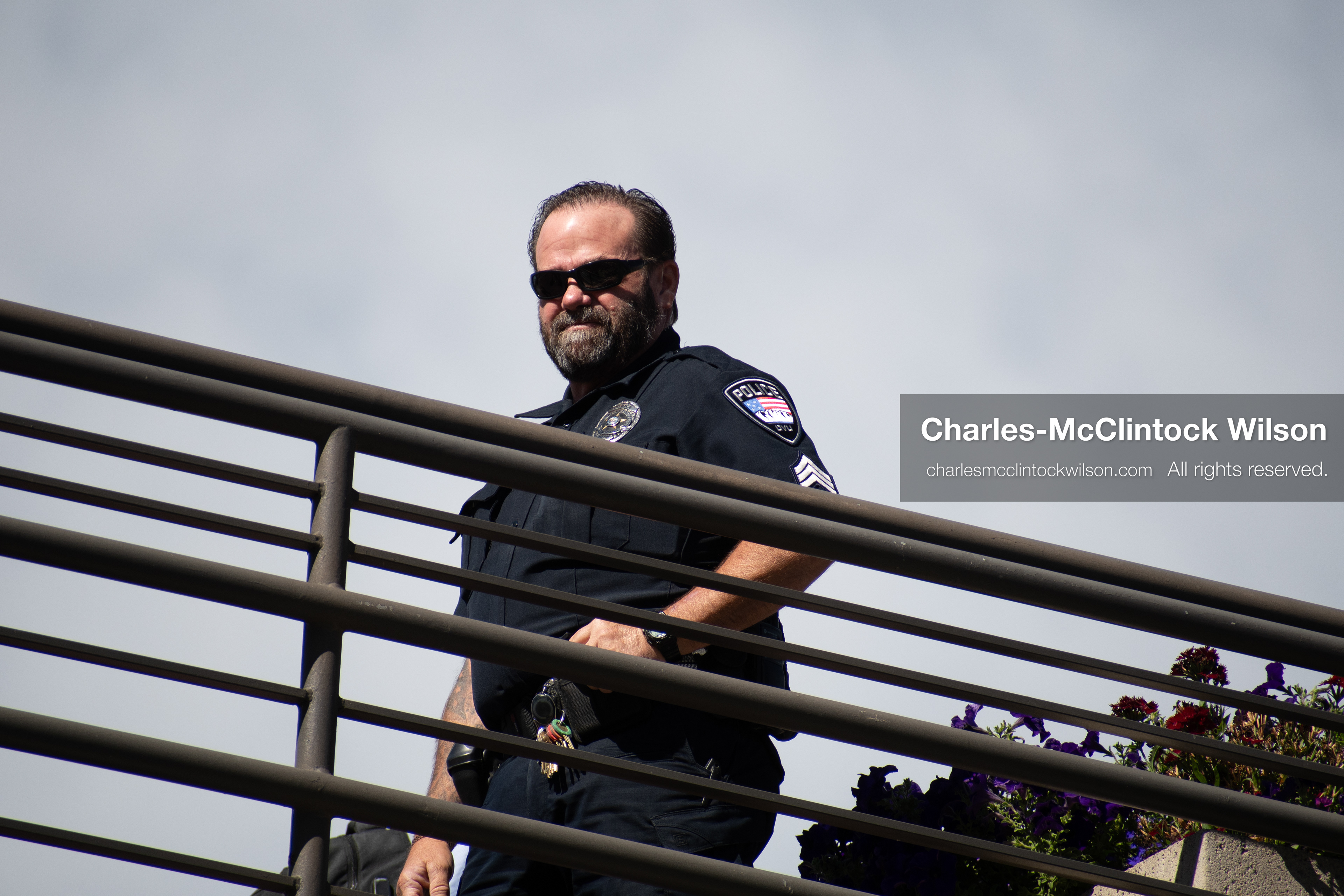 September 10, 2025 – Orem, Utah, United States: A Utah Valley University police officer maintains a security post on an elevated walkway ahead of a scheduled public event featuring conservative activist Charlie Kirk. Photograph by Charles‑McClintock Wilson / ZUMA Press Wire