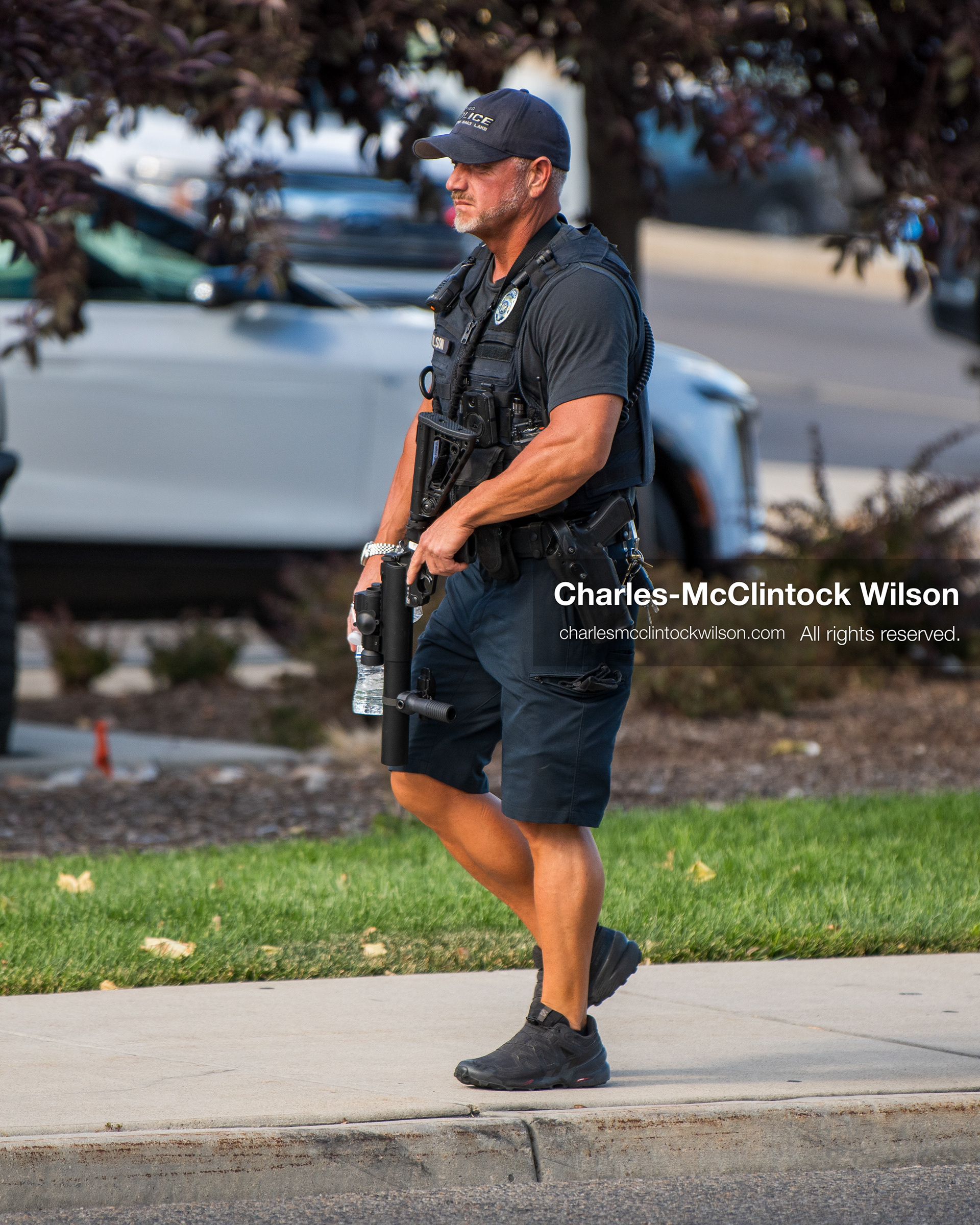 August 17, 2026, Murray, Utah, USA: A local police officer walks along the sidewalk perimeter monitoring traffic outside Intermountain Medical Center on Monday. Multiple police agencies secured the hospital perimeter as a safety precaution after shooting victims were brought in from a fatal shootout outside a funeral in nearby Kearns. (Credit Image: © Charles McClintock Wilson/ZUMA Press Wire)