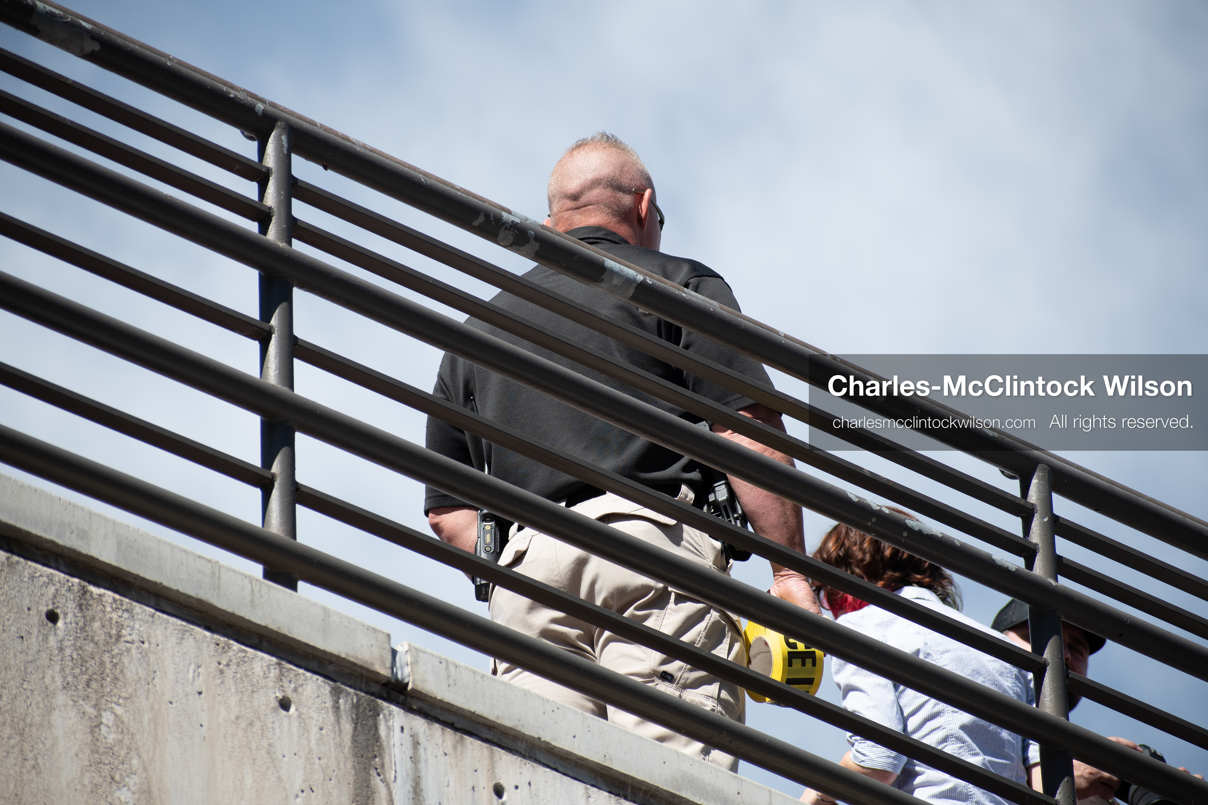 September 10, 2025 – Orem, Utah, United States: A Utah Valley University police officer maintains a security post on an elevated walkway ahead of a scheduled public event featuring conservative activist Charlie Kirk. Photograph by Charles‑McClintock Wilson / ZUMA Press Wire