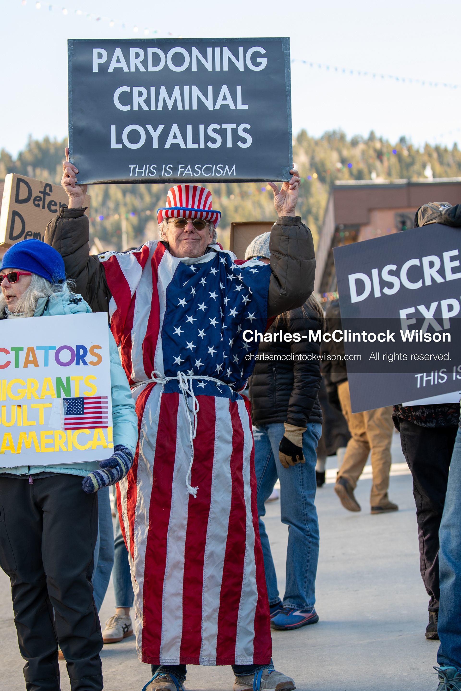 January 26, 2026, Park City, Utah, USA: A demonstrator dressed in an American flag-themed outfit holds a sign while participating in a protest opposing U.S. Immigration and Customs Enforcement (I.C.E.) ICE agents at the Sundance Film Festival in Park City, Utah, on Monday, Jan. 26, 2026. The event was held in response to the fatal shooting of Alex Pretti by a U.S. Border Patrol officer in Minneapolis. (Credit Image: © Charles McClintock Wilson/ZUMA Press Wire)