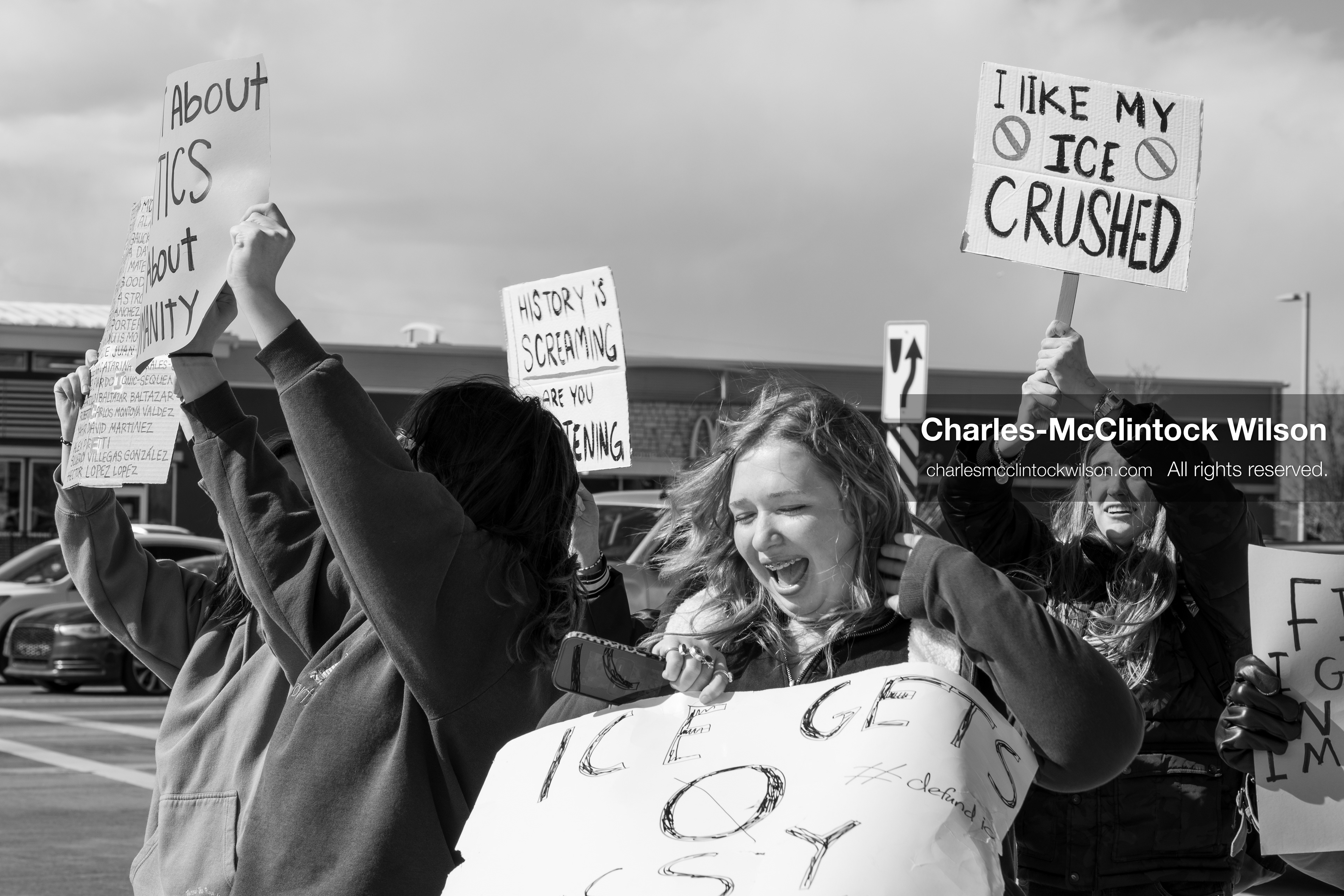 February 20, 2026, Orem, Utah, USA: High school students gather along State Street in front of Orem City Hall during a student led protest against ICE and federal immigration enforcement. Demonstrators hold signs as they stand near the roadway while traffic continues through the area. (Credit Image: © Charles McClintock Wilson/ZUMA Press Wire)